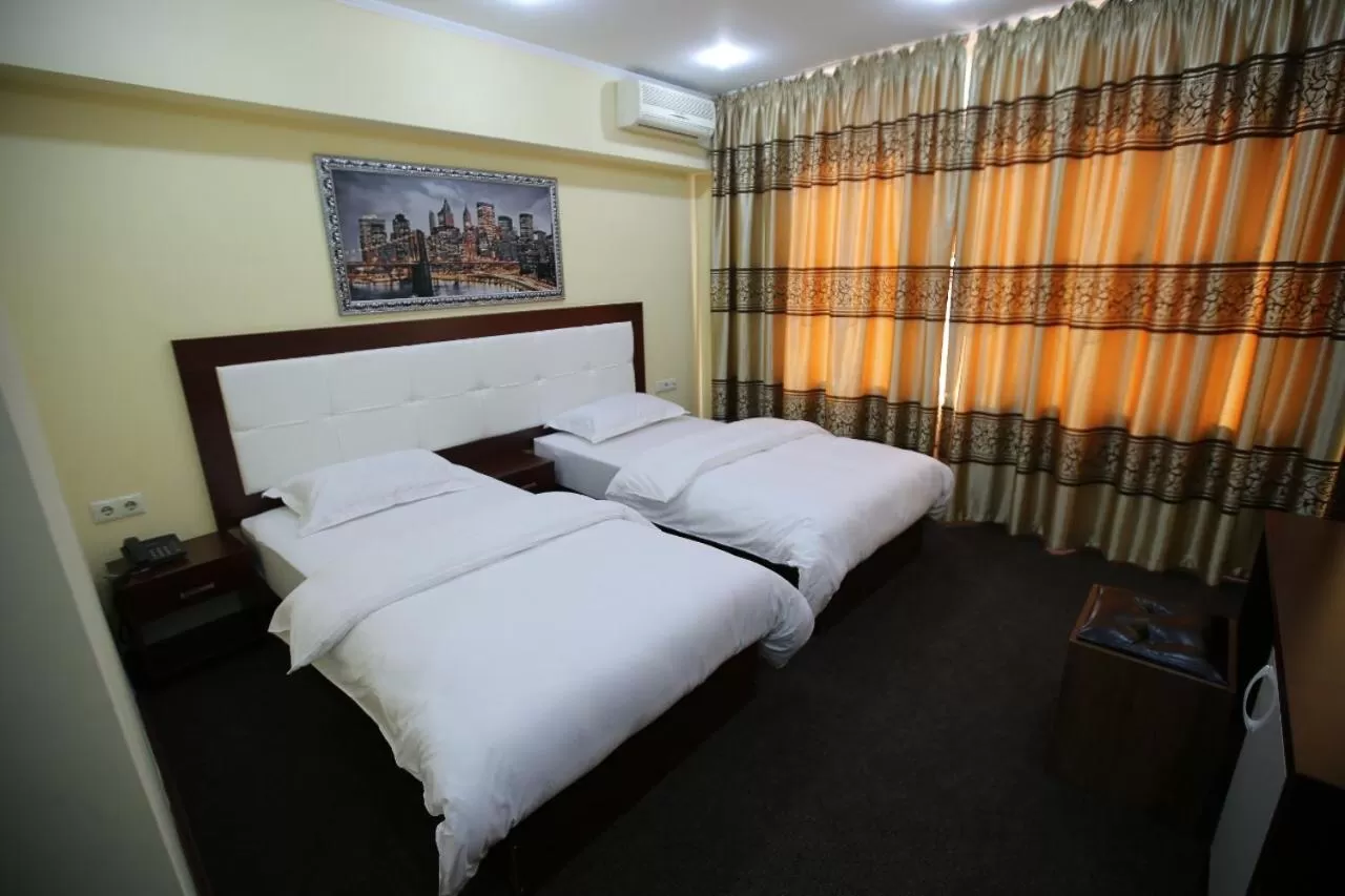 Bed in Altai Business Hotel