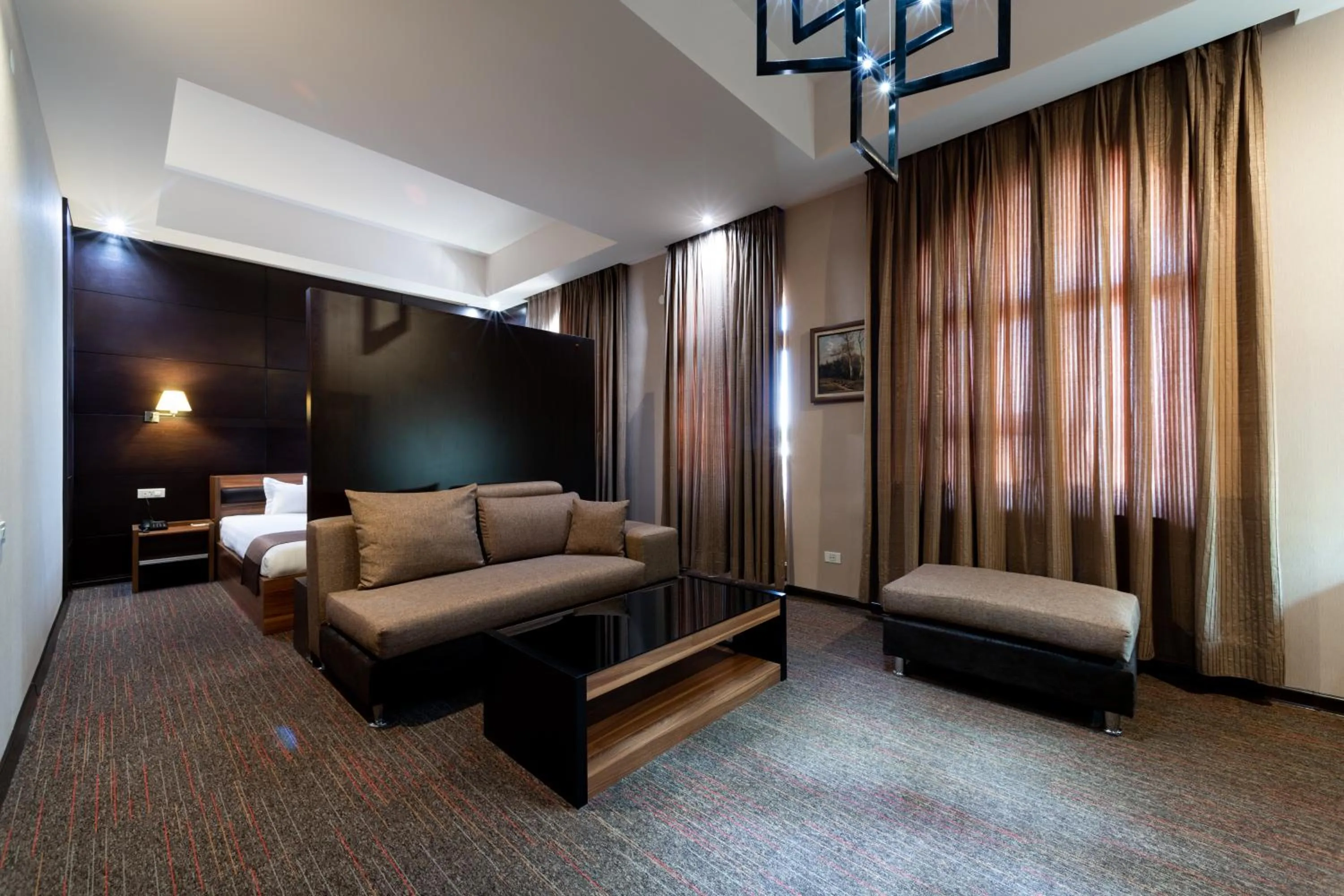 Living room, Bed in Bass Boutique Hotel