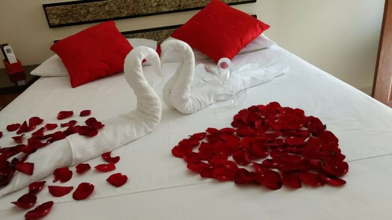 Bed in Pousada Palmares