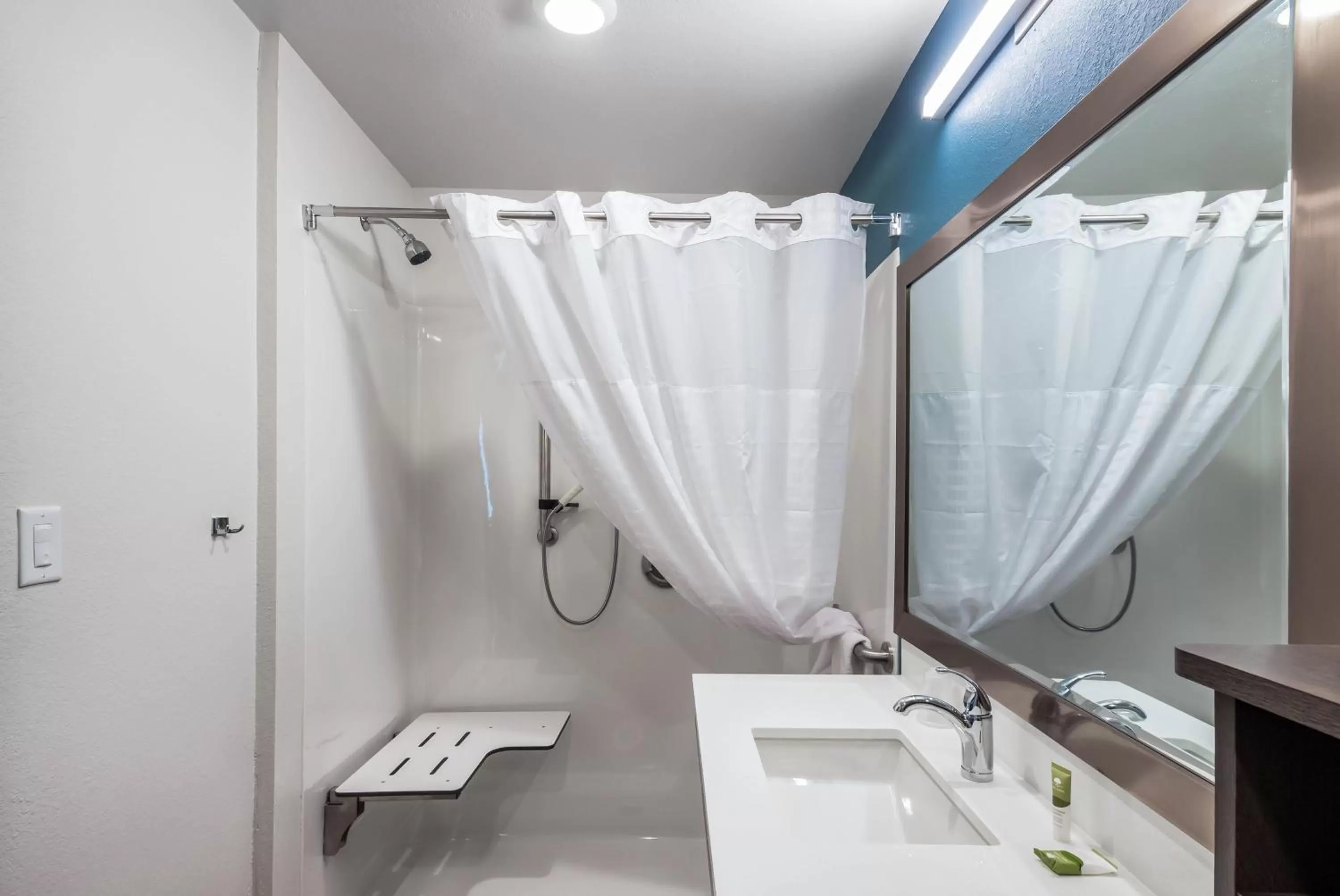 Bathroom in WoodSpring Suites St Louis Arnold