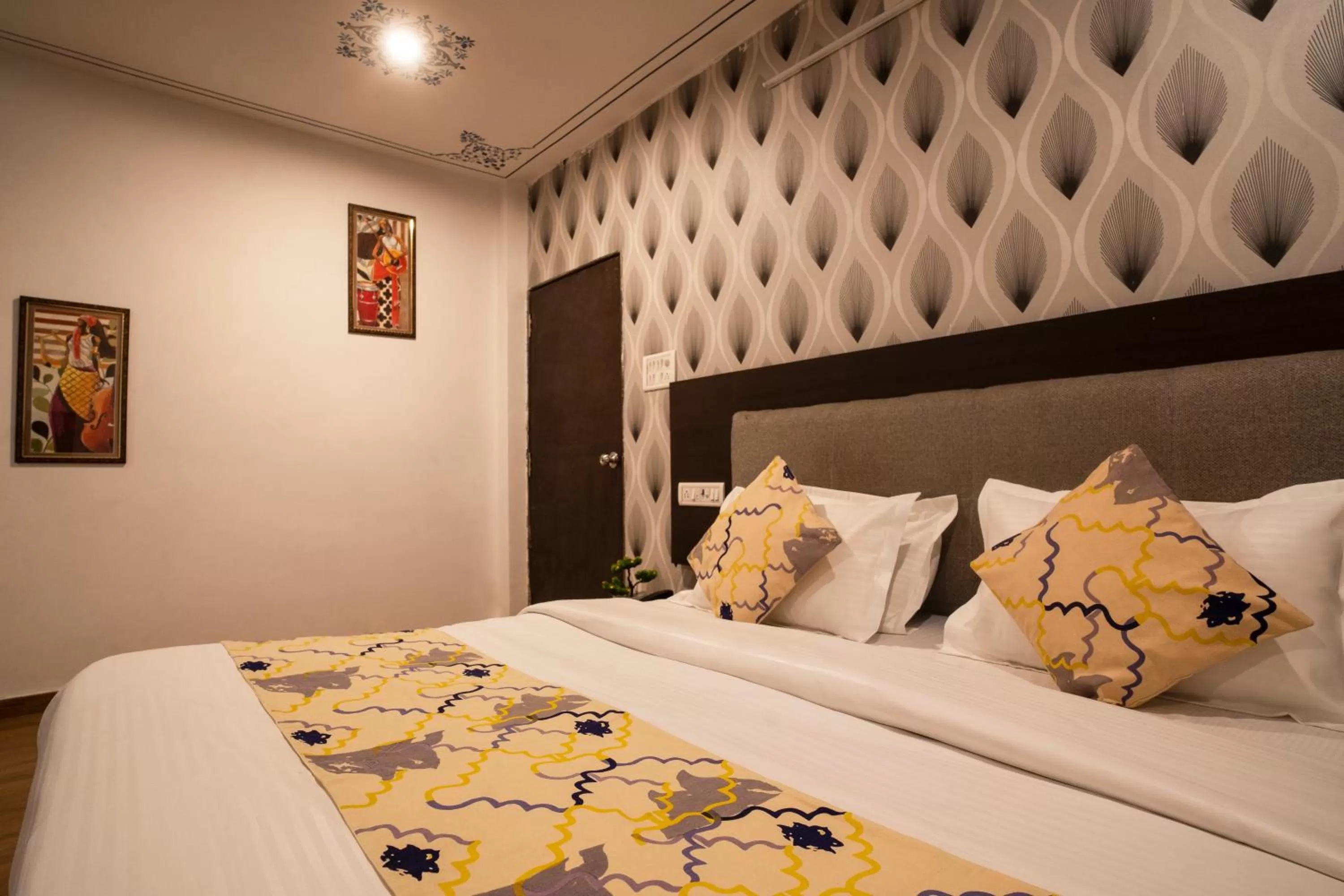 Bed in Tripli Hotels Arunoday Palace