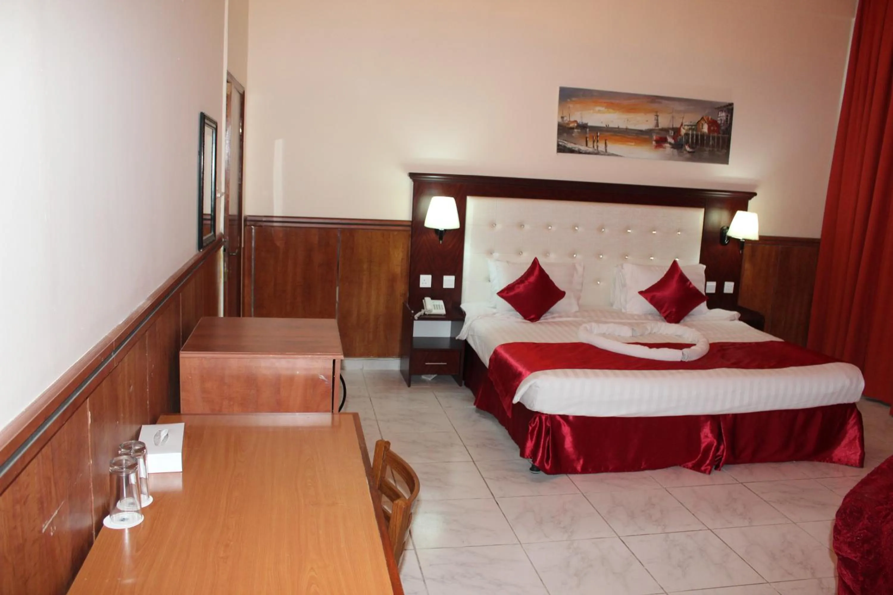 Bed in Grand Nova Hotel