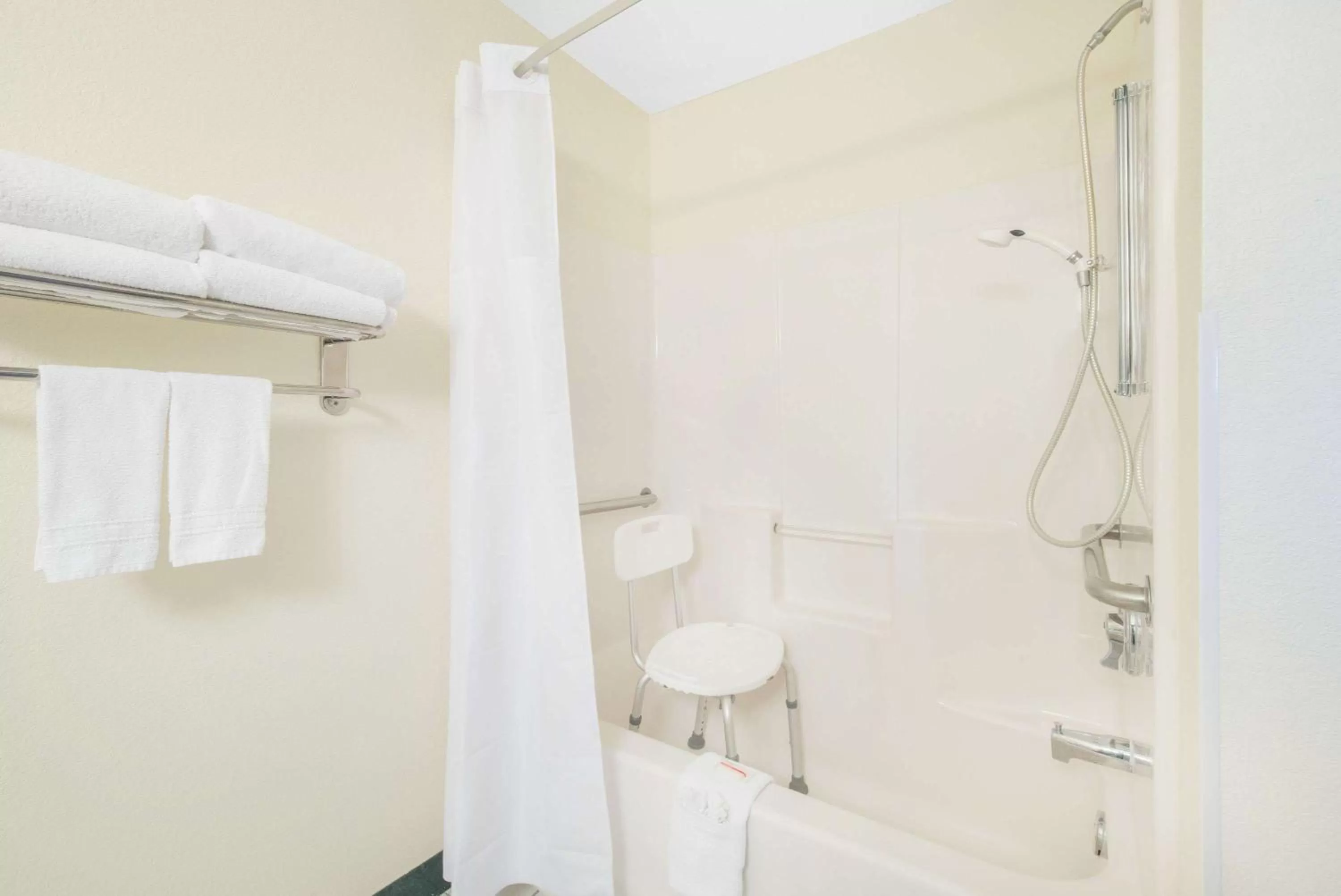 Bathroom in Days Inn & Suites by Wyndham Fargo 19th Ave/Airport Dome