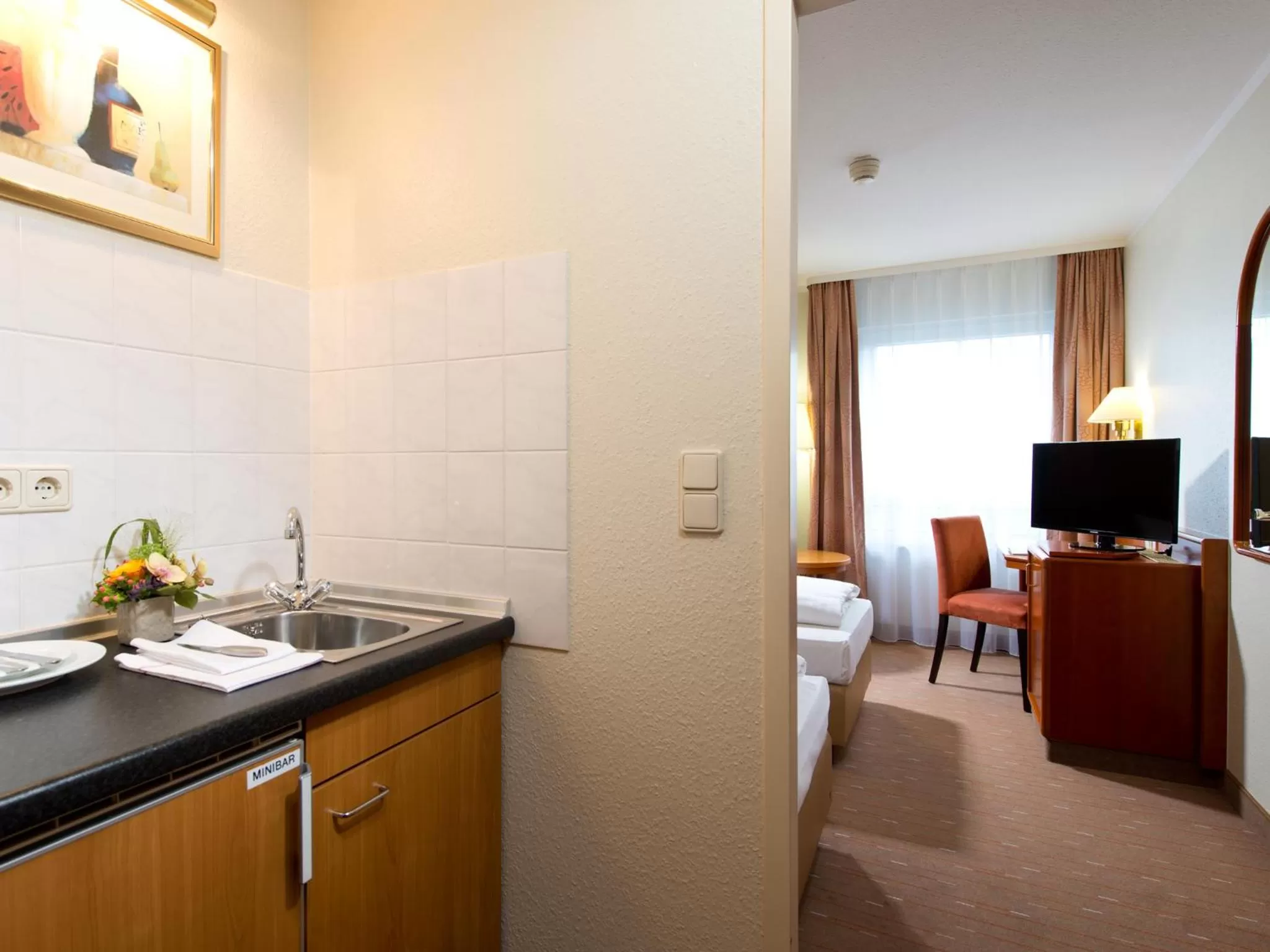 Kitchen or kitchenette, Bed in ACHAT Hotel Schwarzheide Lausitz