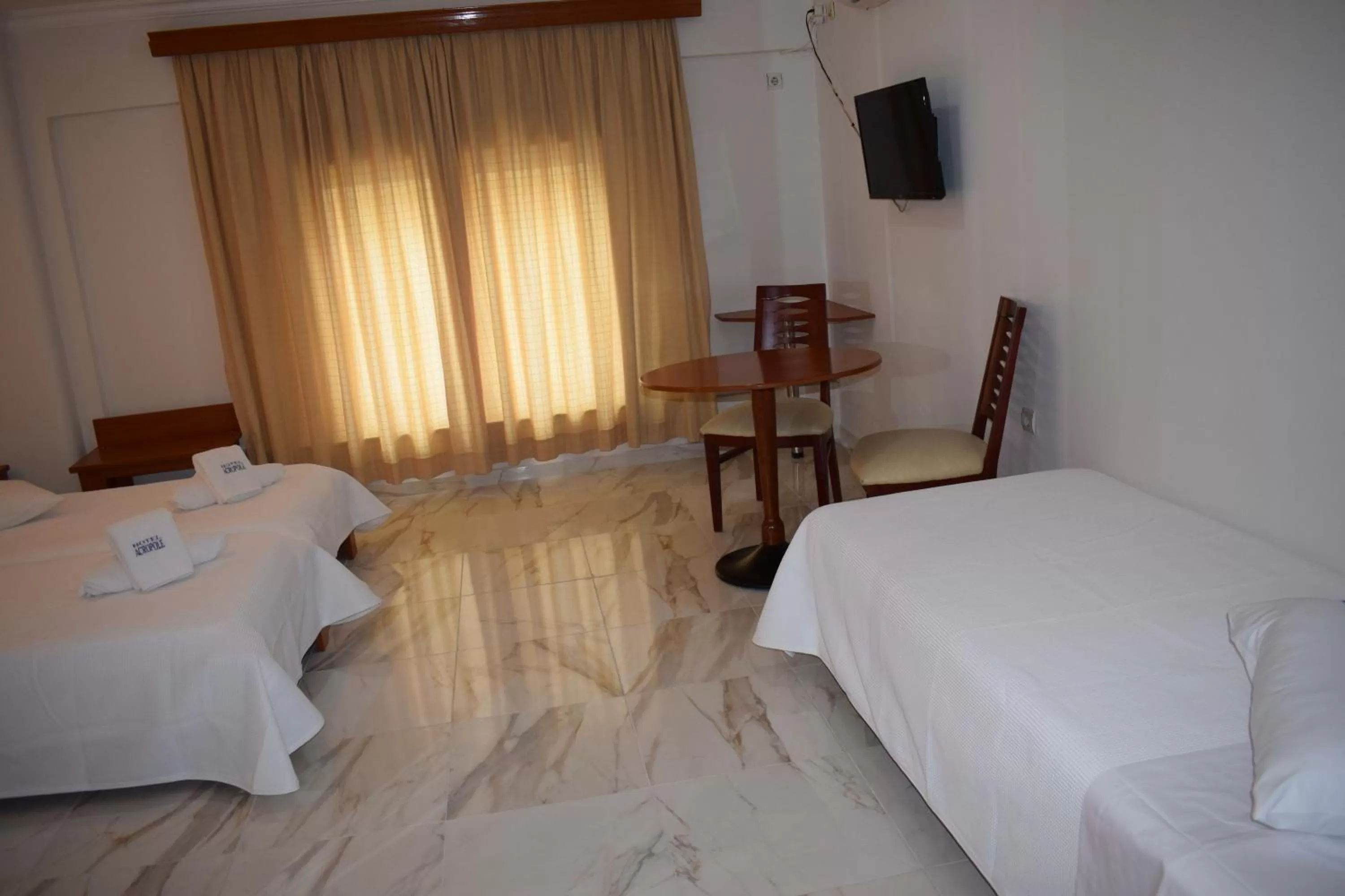 Bed in Piraeus Acropole Hotel