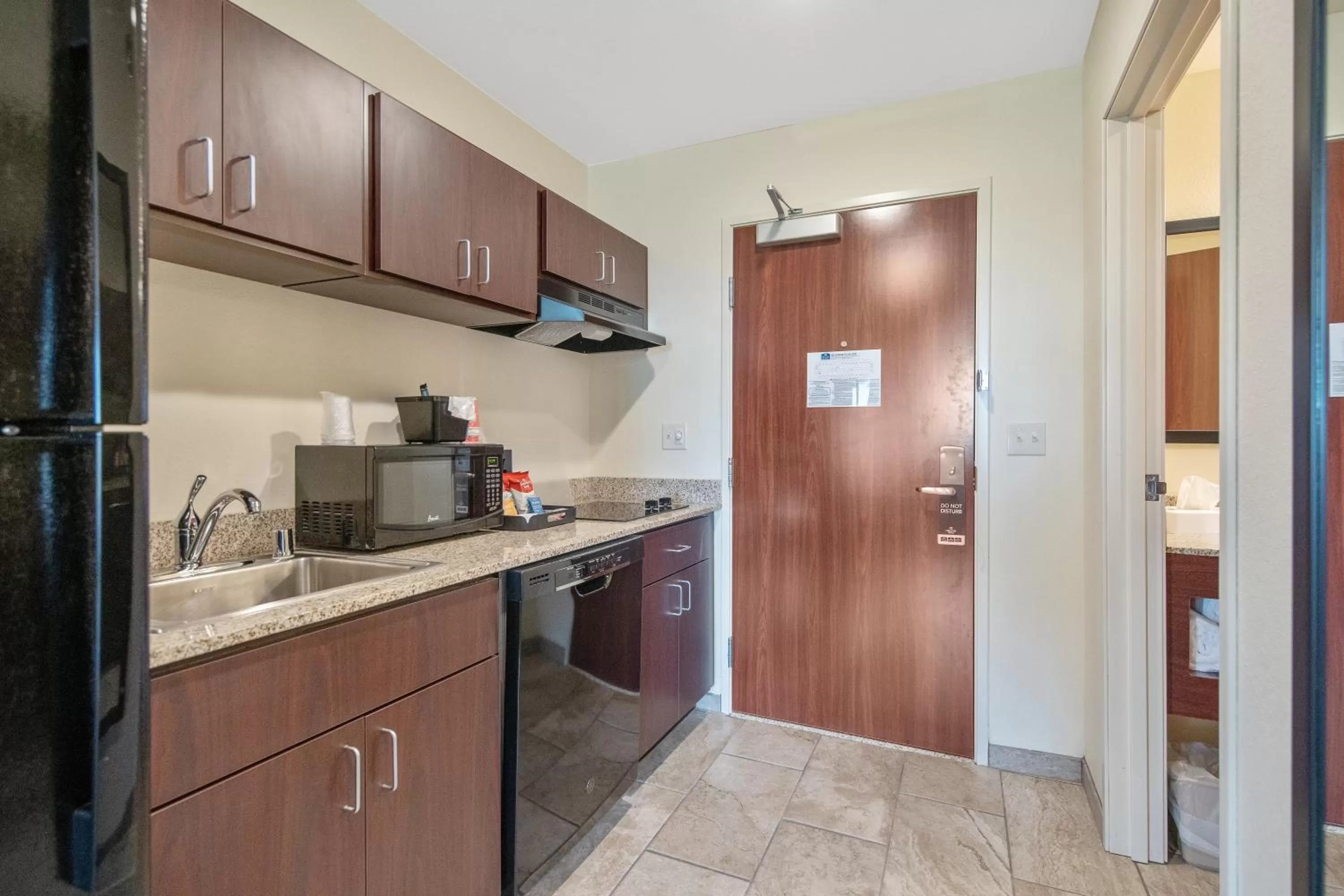 Kitchen or kitchenette in Cobblestone Hotel & Suites - Austin