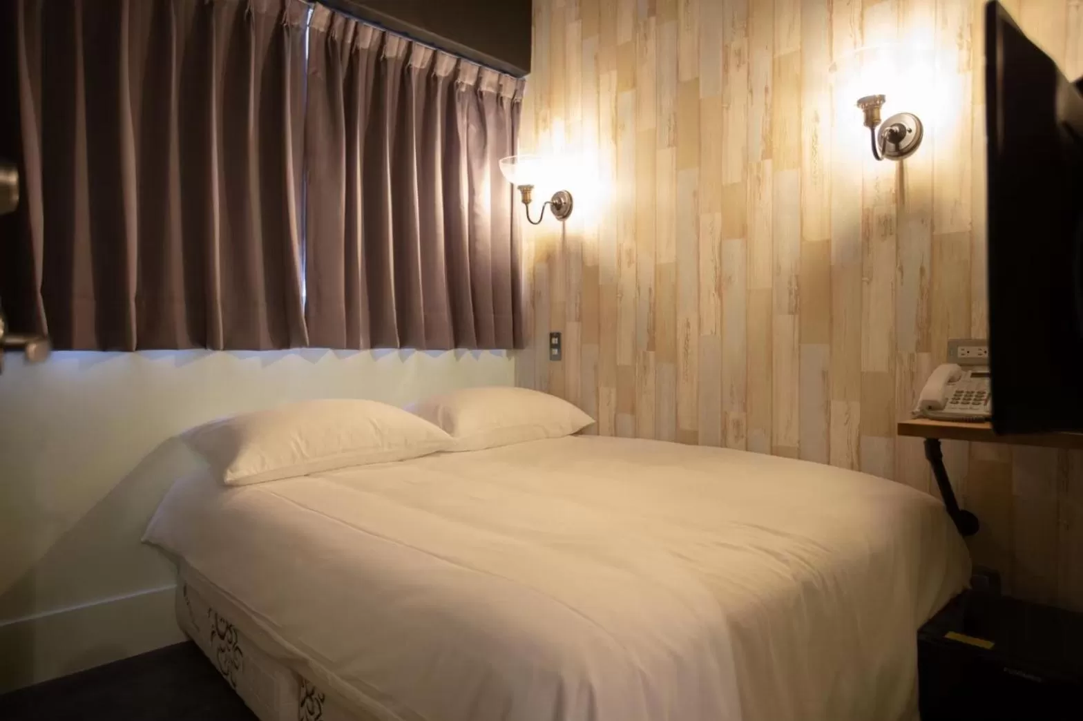 Bed in The Rooms Inn