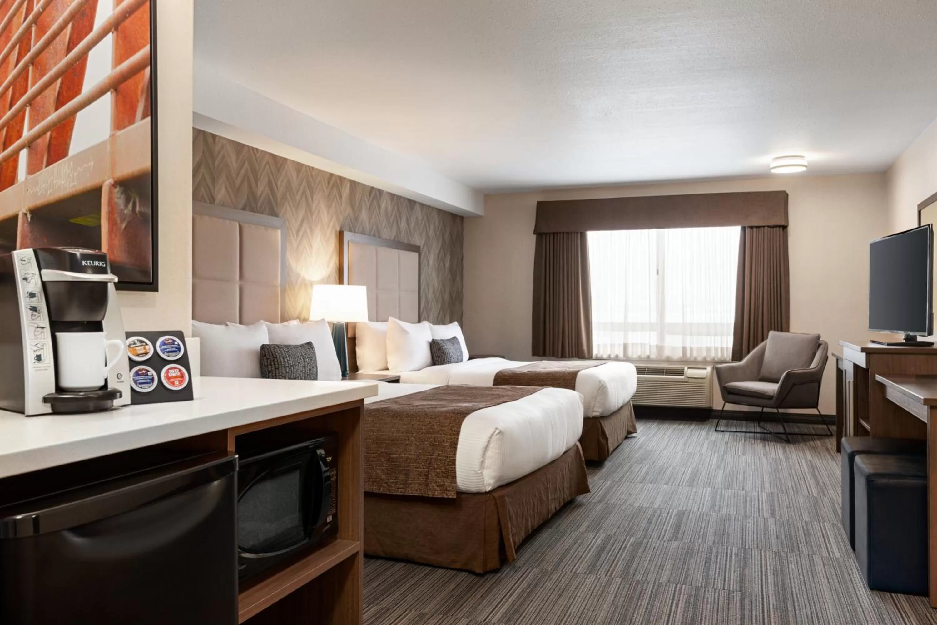 Photo of the whole room, Bed in Ramada by Wyndham Airdrie Hotel & Suites