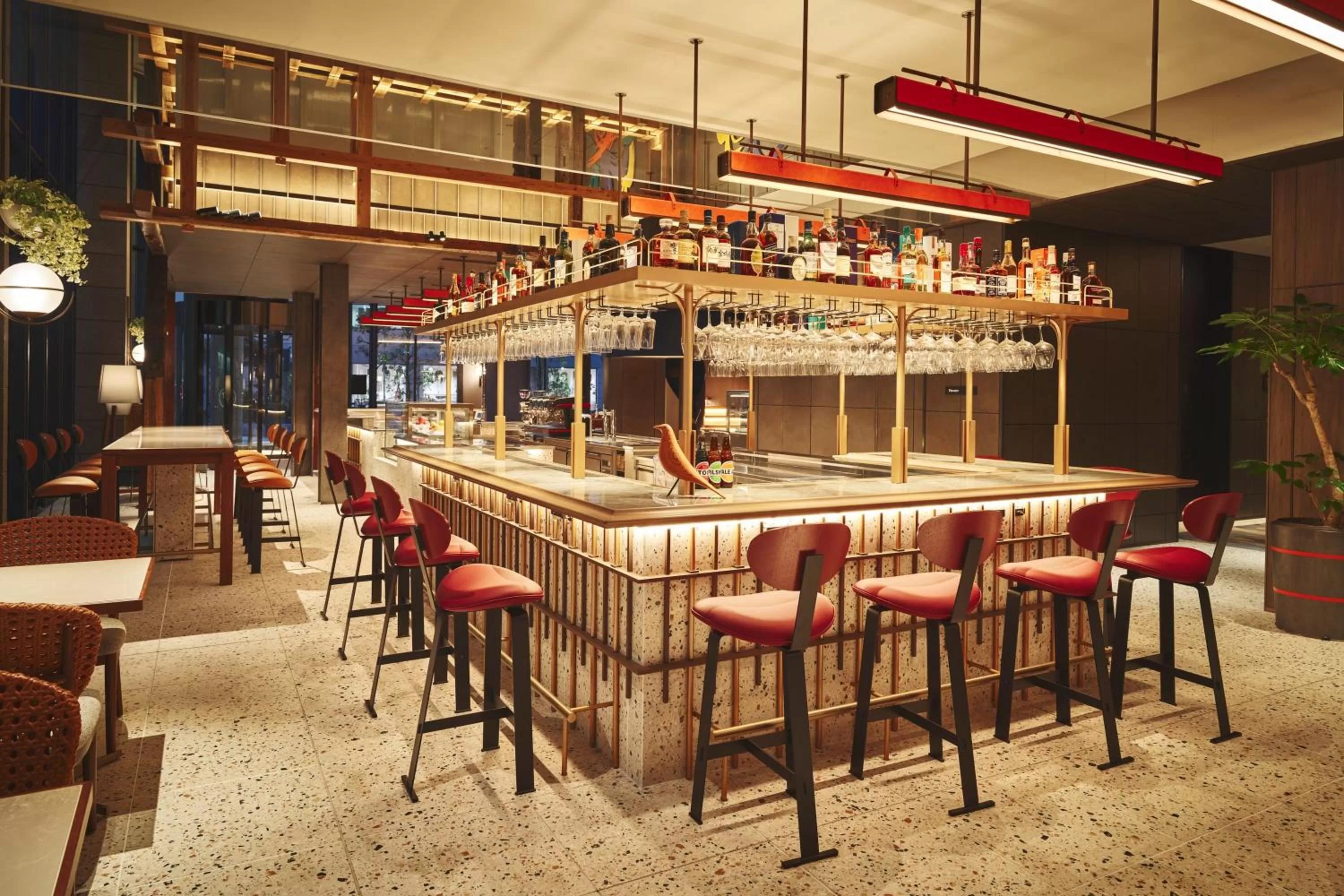 Lounge or bar in voco Osaka Central by IHG