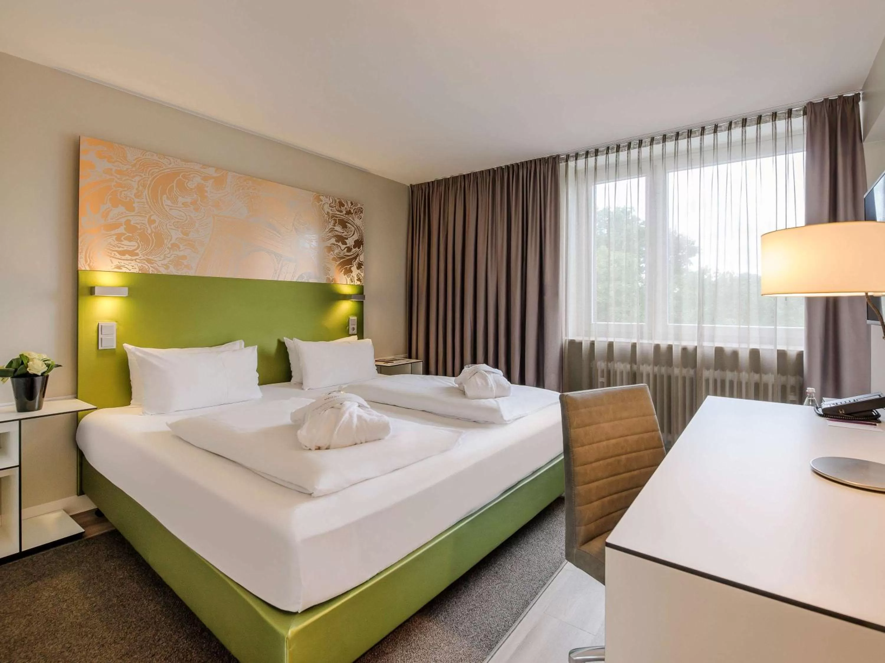 Photo of the whole room, Bed in Congress Hotel Mercure Nürnberg an der Messe