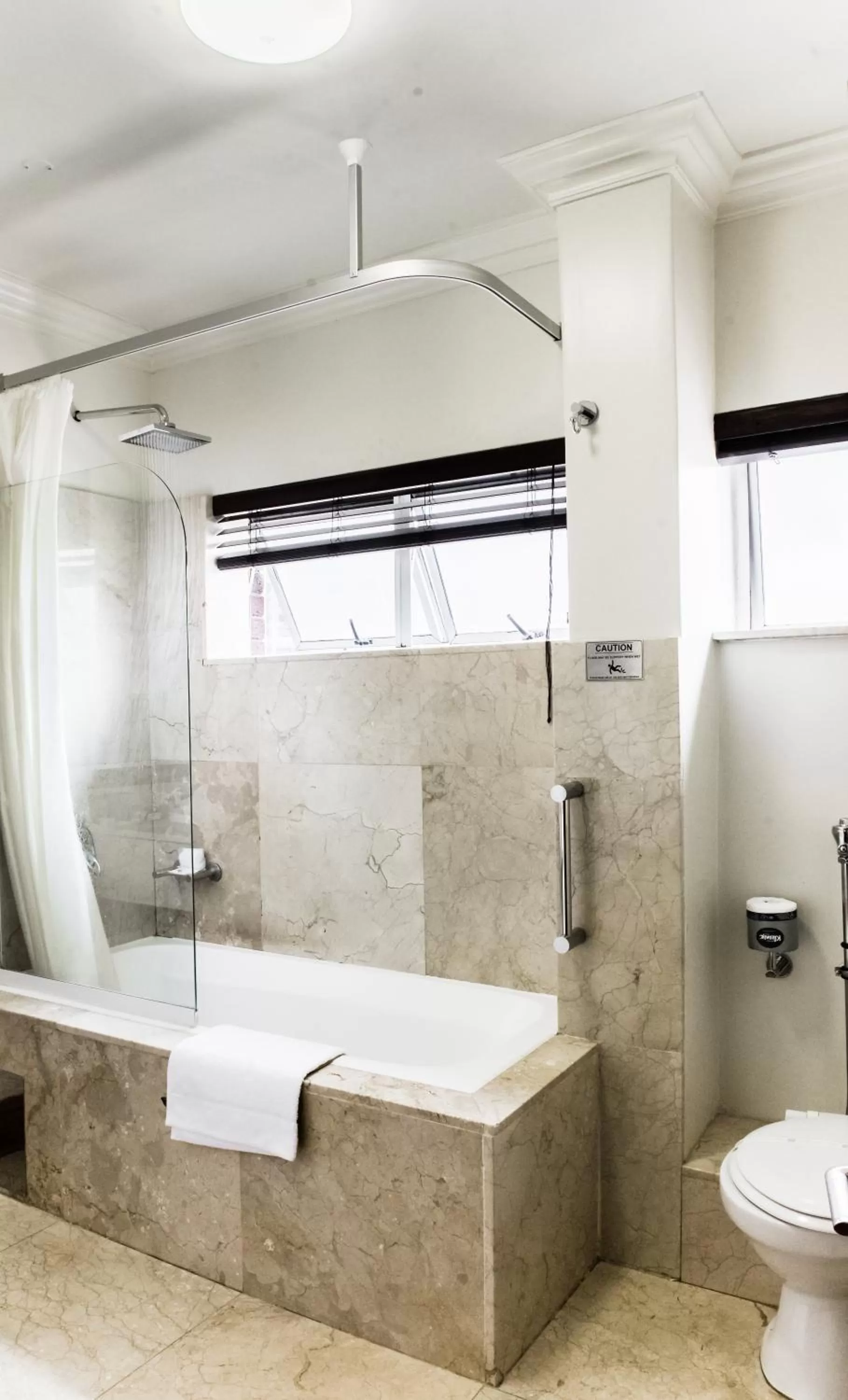 Bathroom in Belaire Suites Hotel