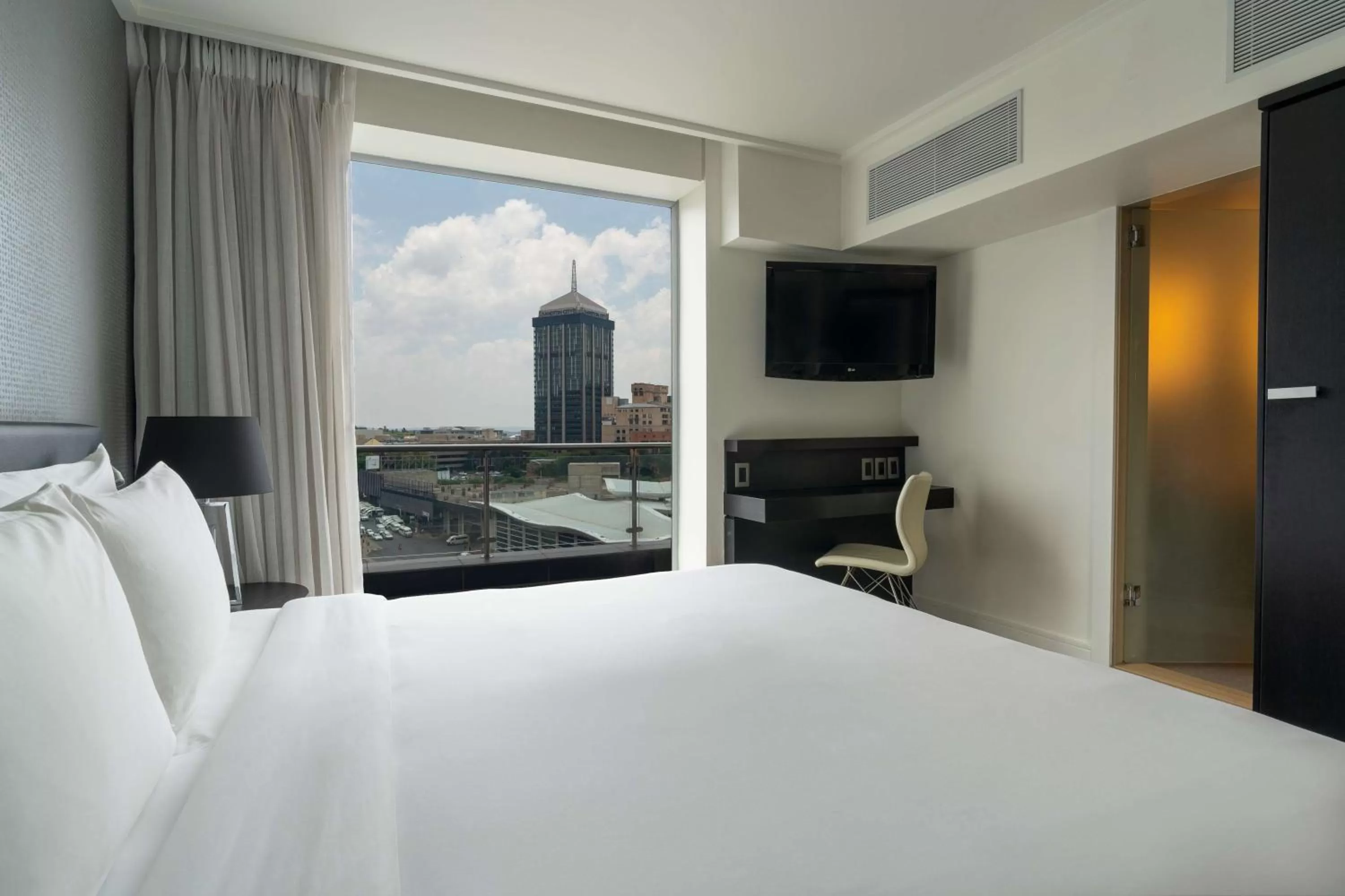 Photo of the whole room, Bed in Radisson Blu Gautrain Hotel, Sandton Johannesburg