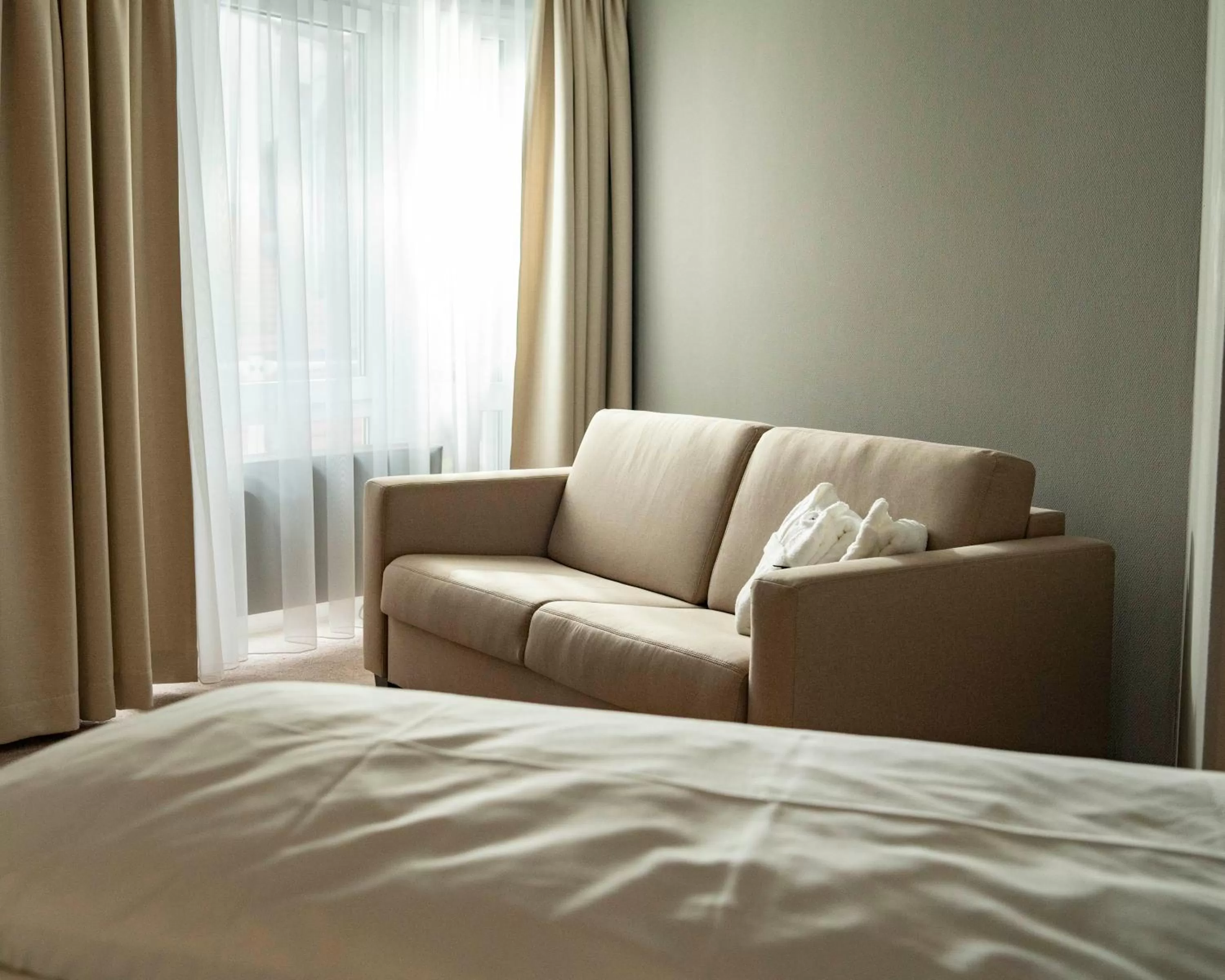 Seating area, Bed in AWA Hotel