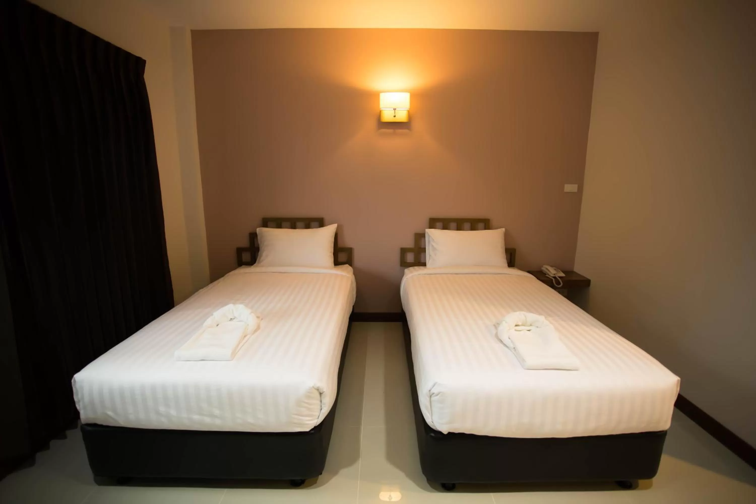 Bed in Thaimit Resort