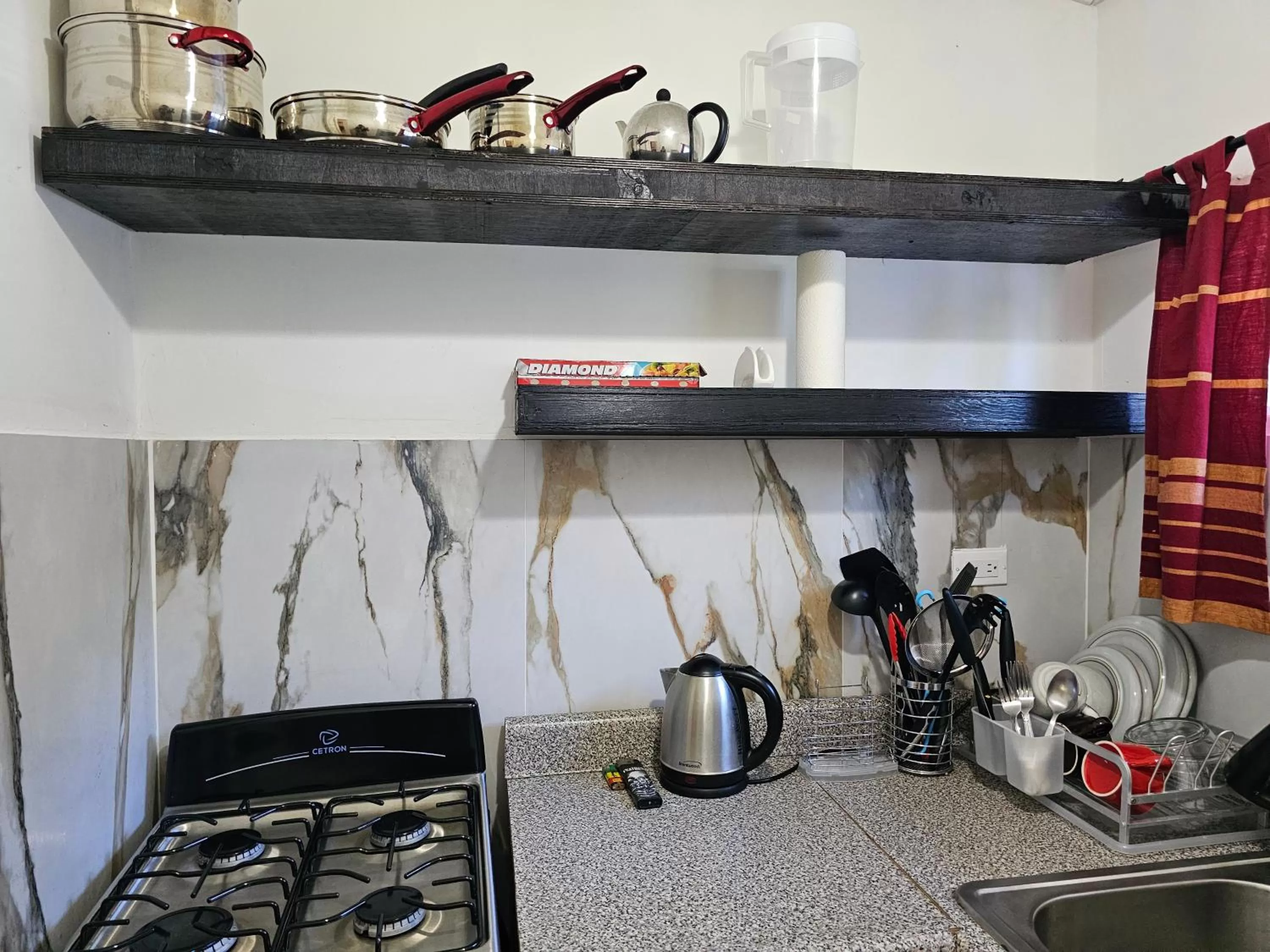 Kitchen or kitchenette in Roots Cafe Rooms