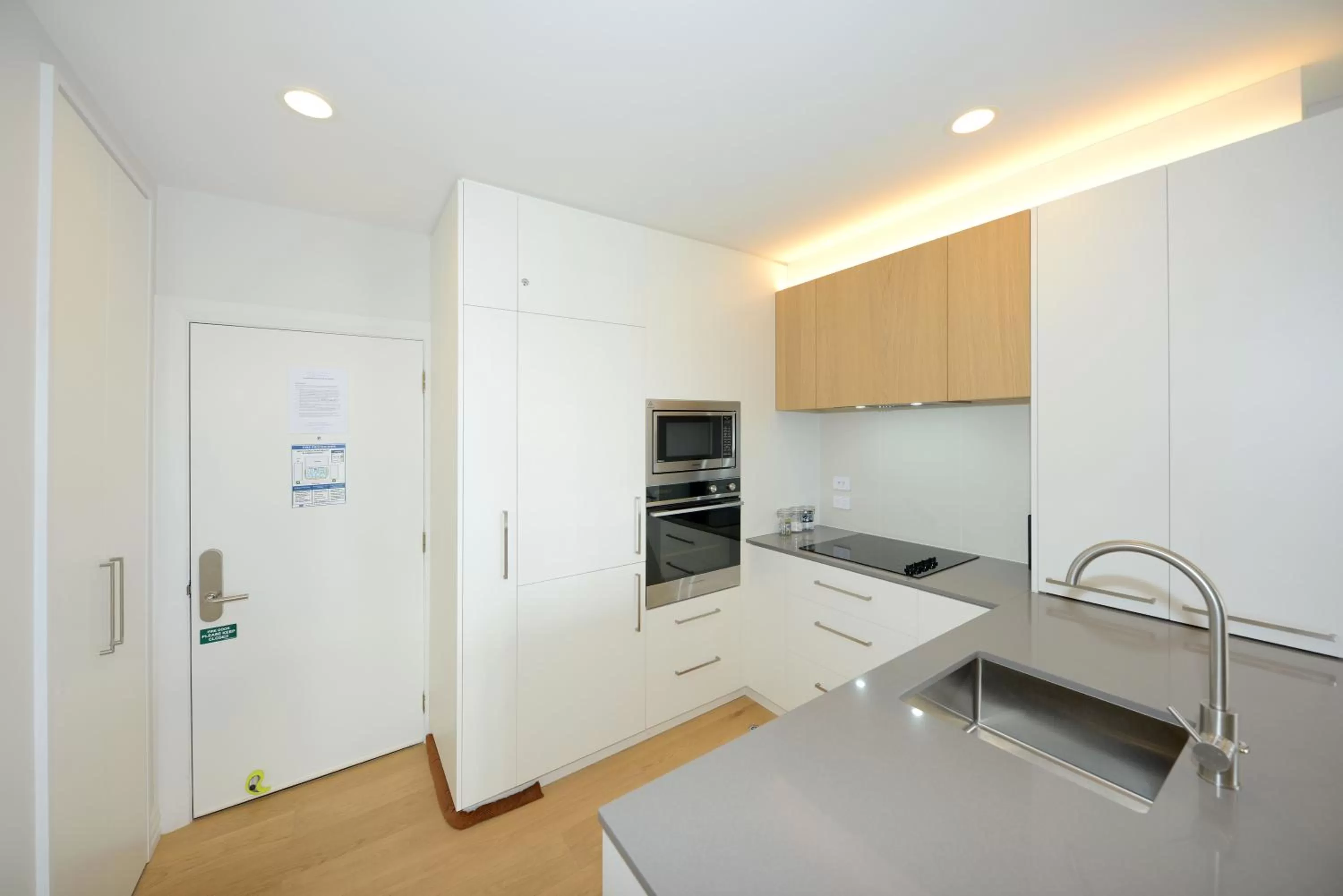 Kitchen or kitchenette in West Fitzroy Apartments