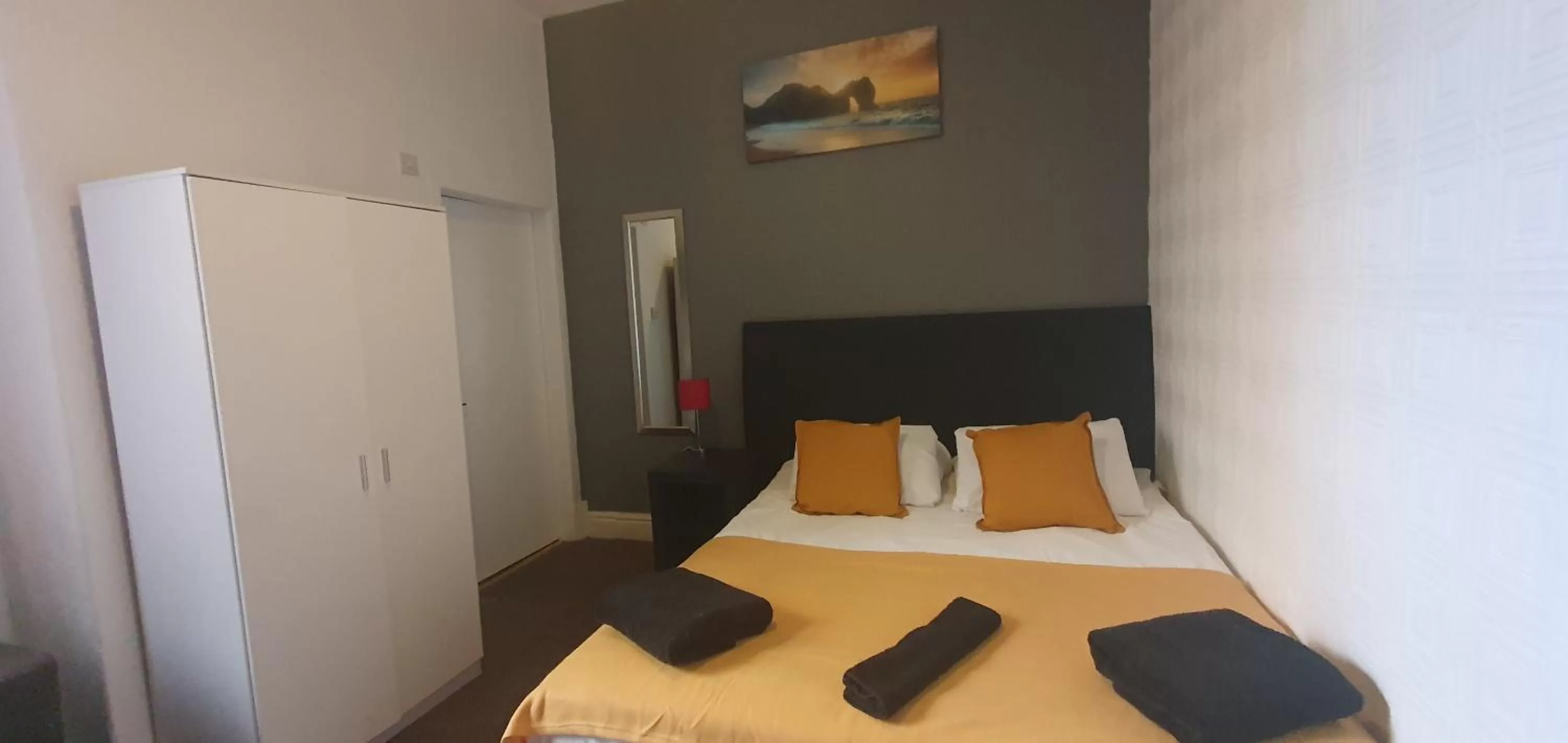 Bed in Palm Beach Hotel by the Sea