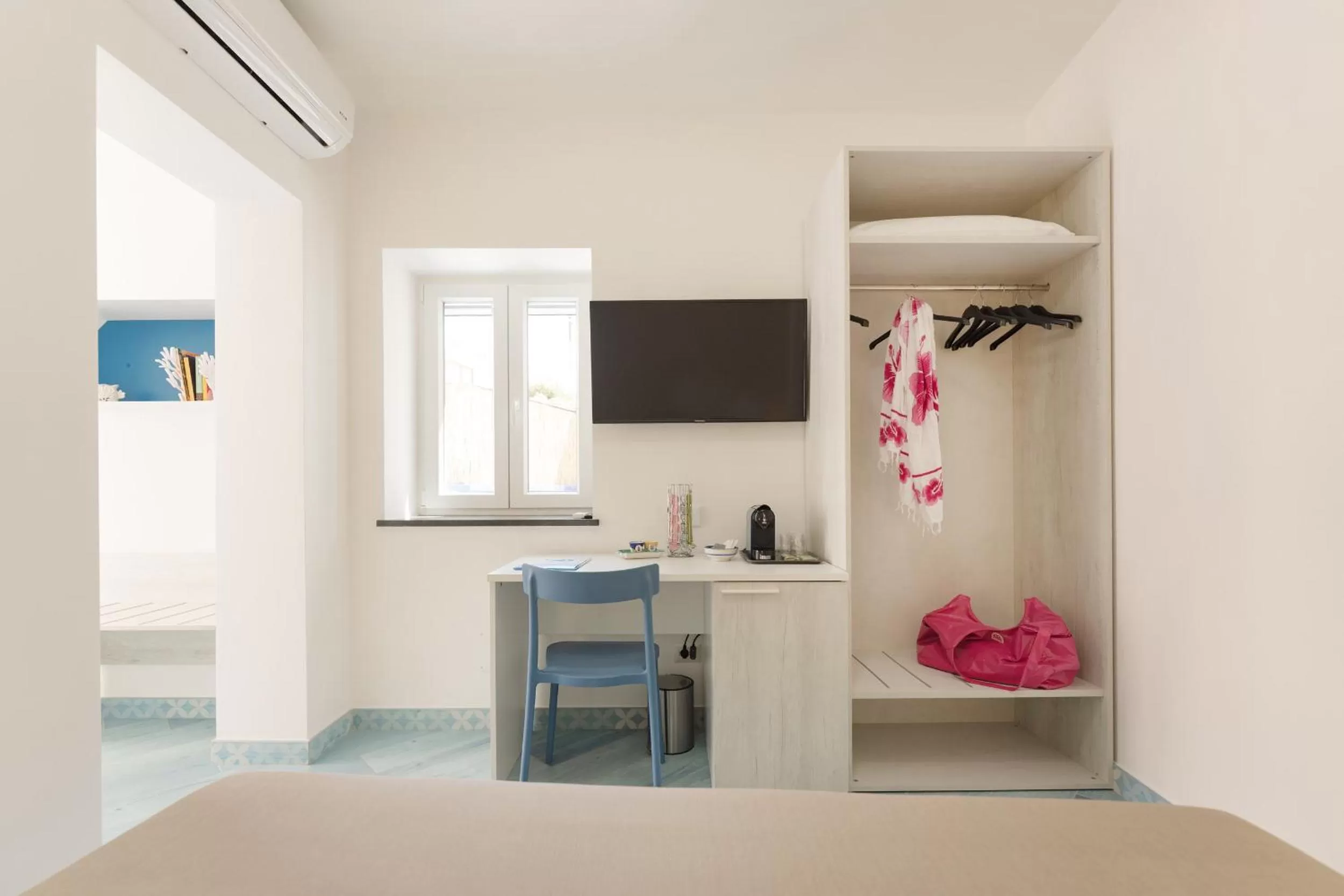 Bed in Poseidonia Rooms