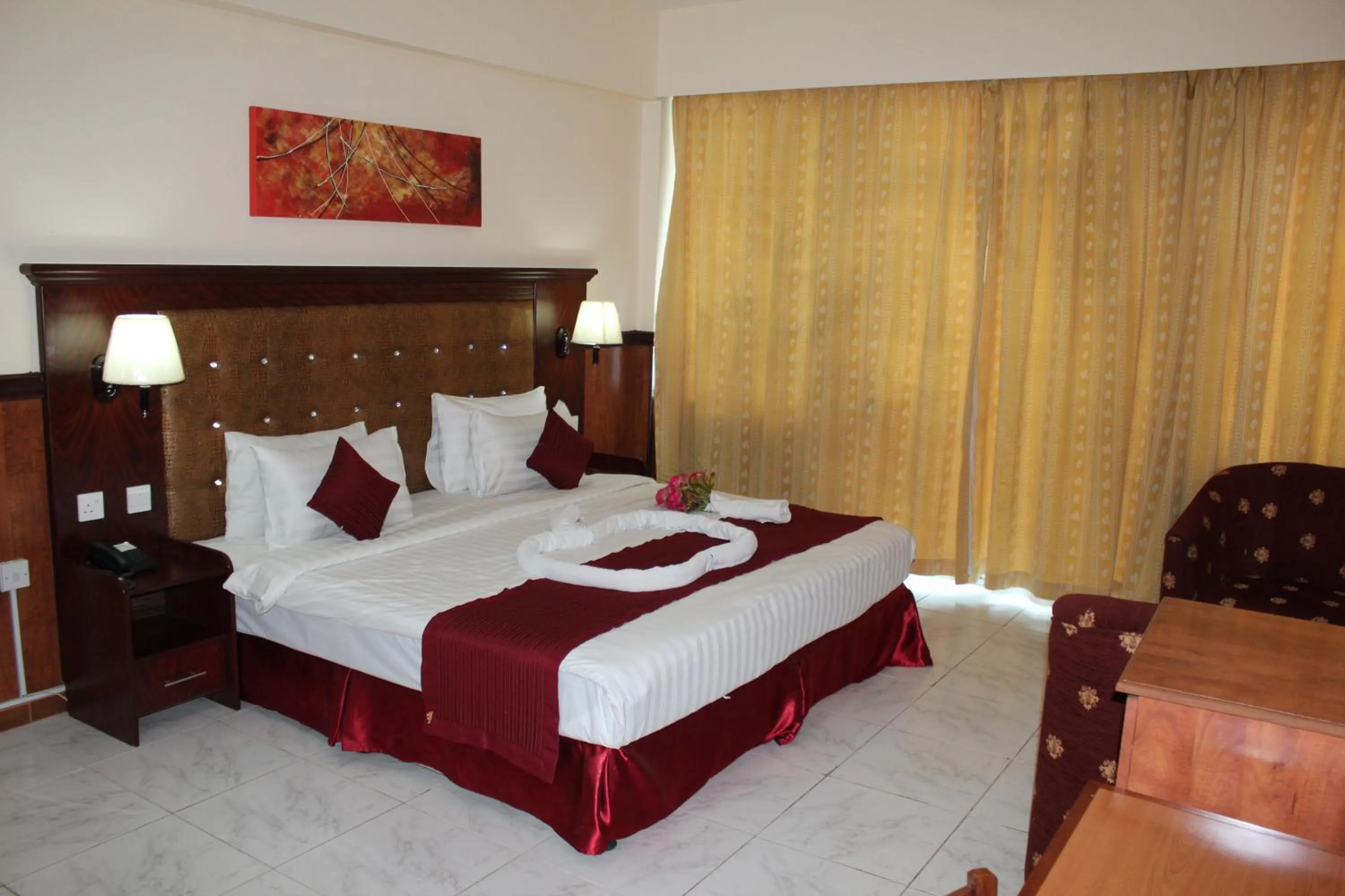 Bed in Grand Nova Hotel