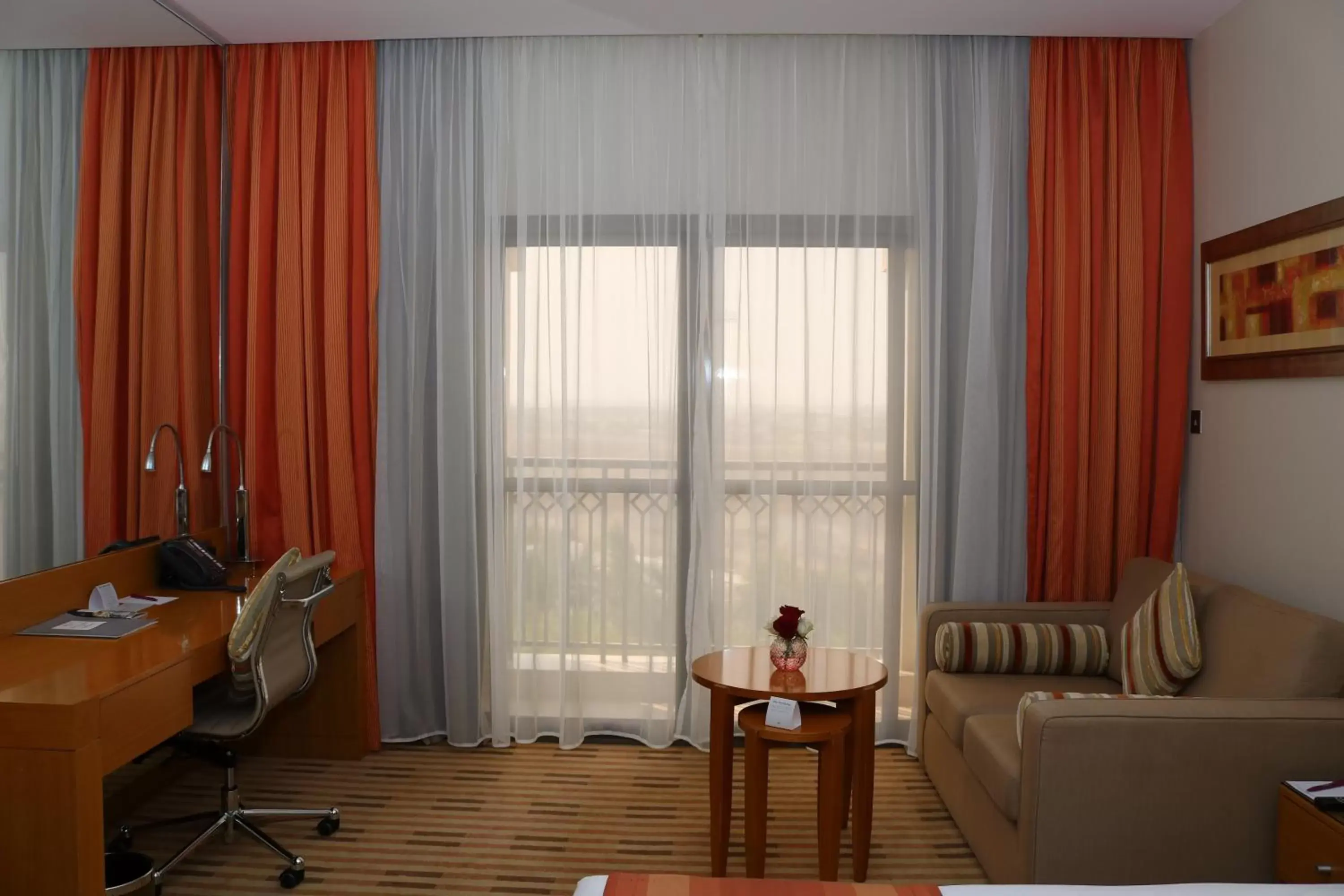 Standard King Room with Sofa Bed and Balcony in Crowne Plaza Sohar by IHG Standard King Room with Sofa Bed and Balcony in Crowne Plaza Sohar by IHG