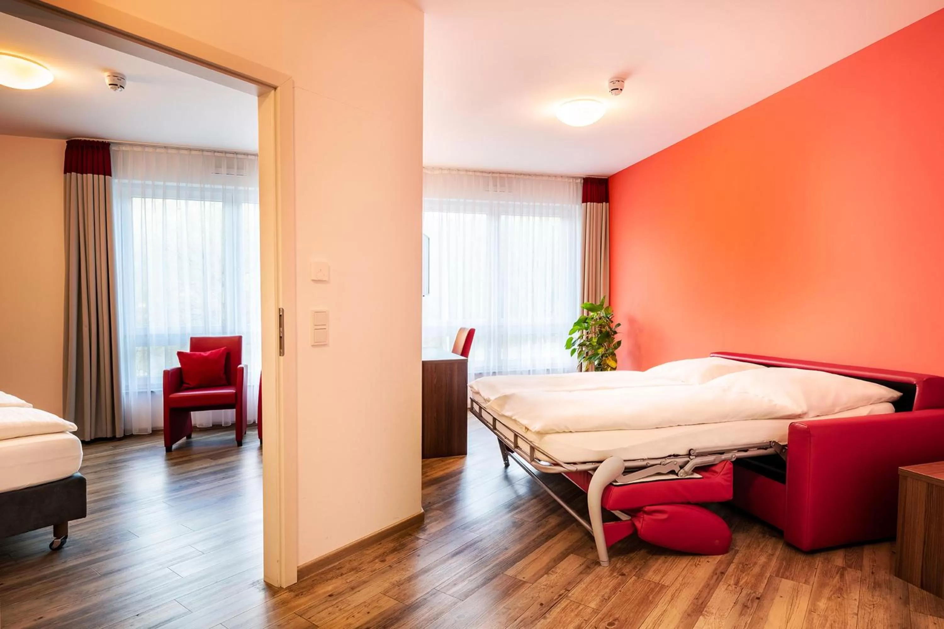 Living room, Bed in Schroeders Wein-Style-Hotel