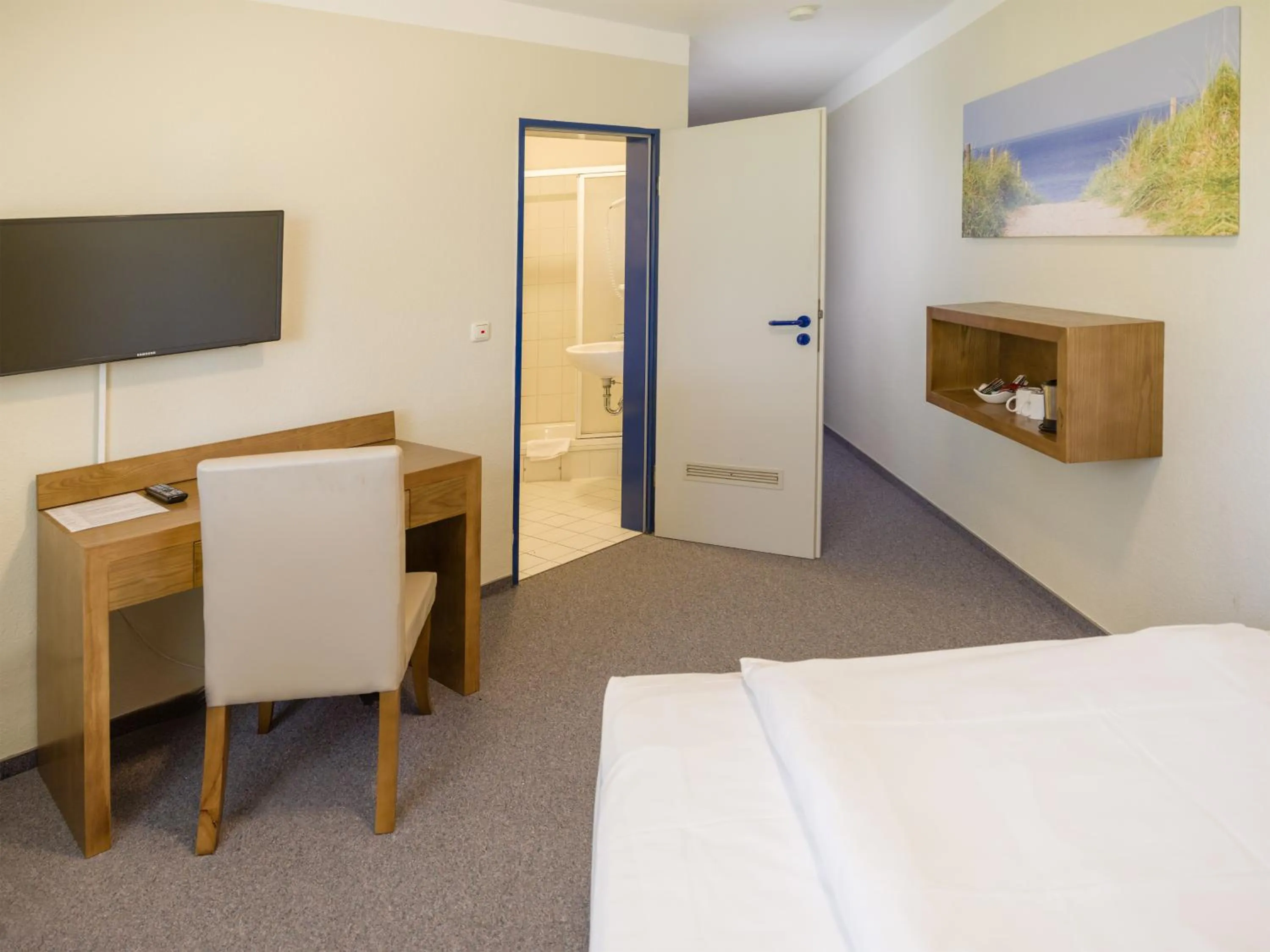 Photo of the whole room, Bed in Hotel Königstein Kiel by Tulip Inn