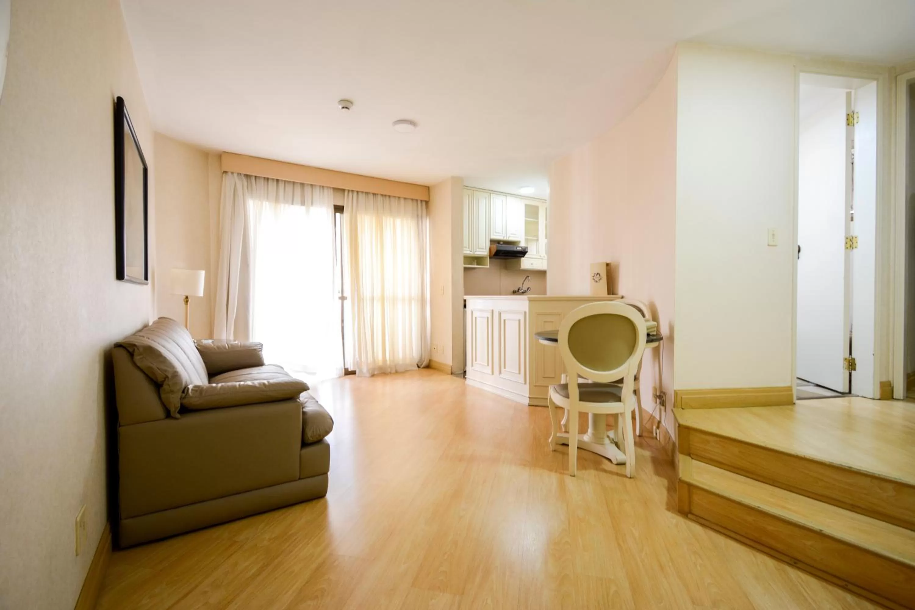 Living room, Seating Area in Wall Street Apartments by BnbHost