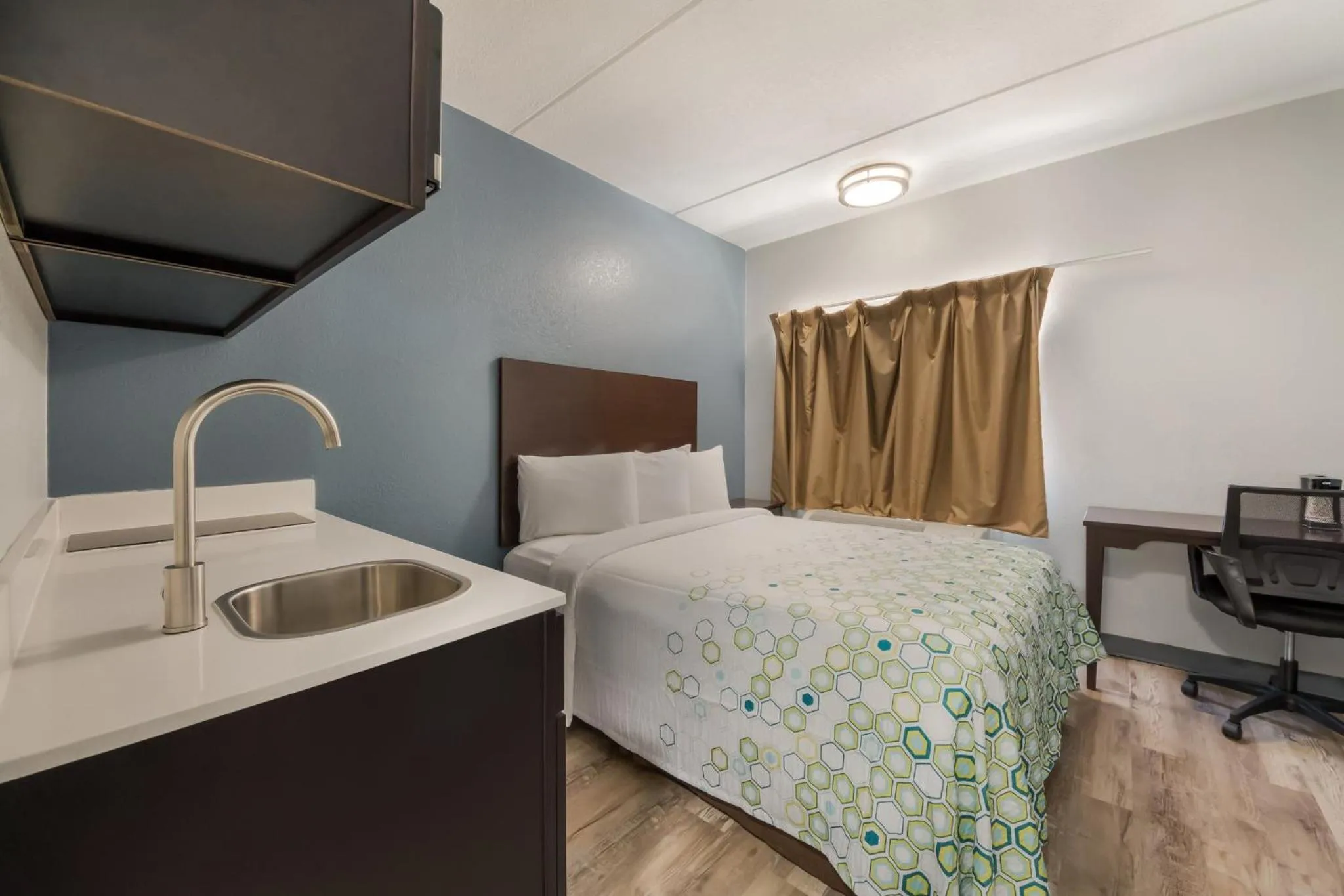Bedroom, Bed in HomeTowne Studios by Red Roof San Antonio - SeaWorld Northwest