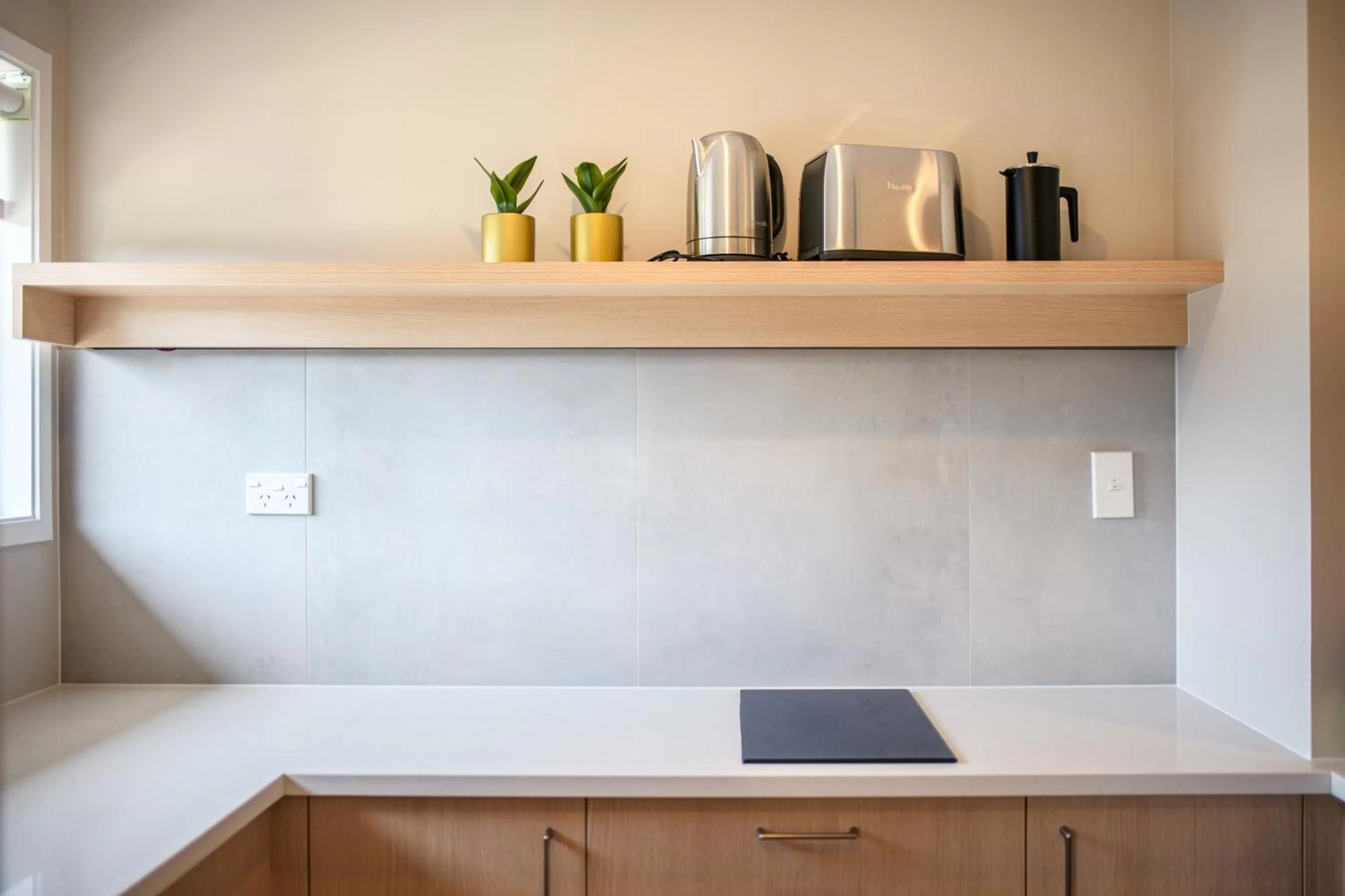 Kitchen or kitchenette in Takapuna International Motor Lodge