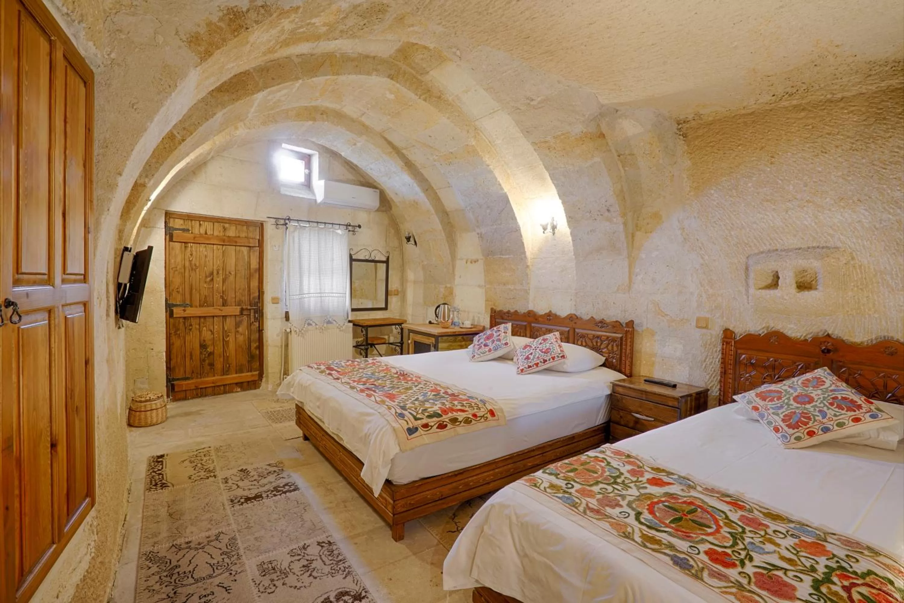 Bed in Tulip Cave Suites