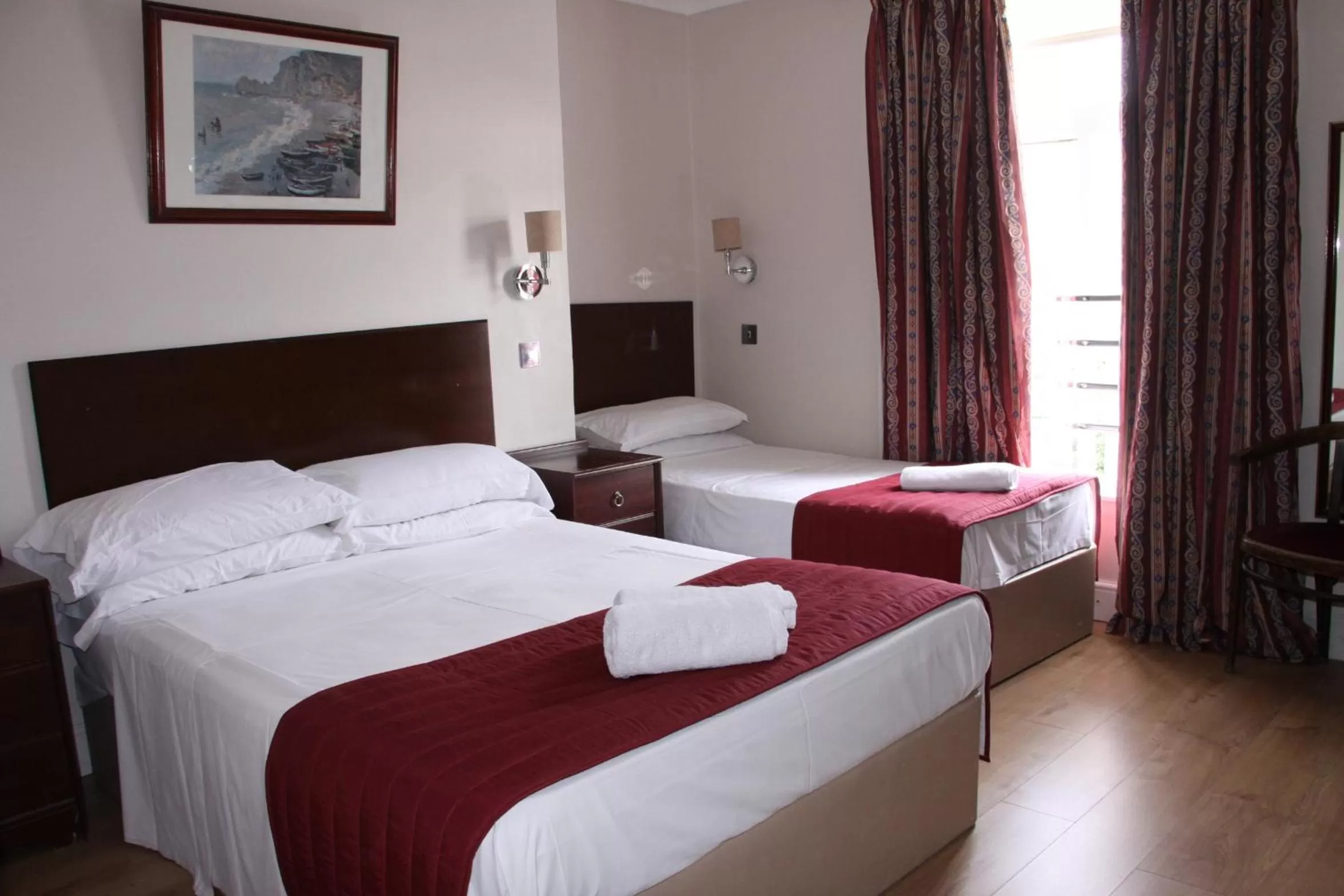 Bed in Ambassador Hotel