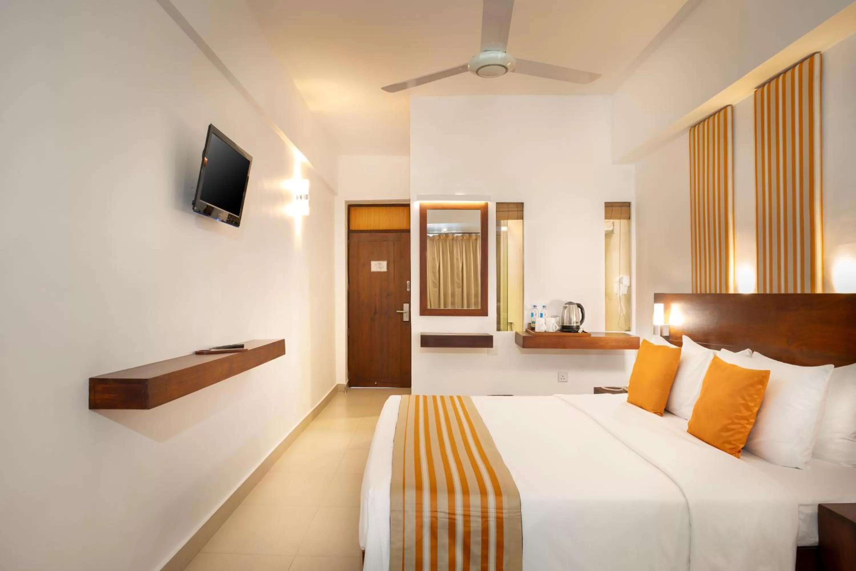 Bed in Camelot Beach Hotel