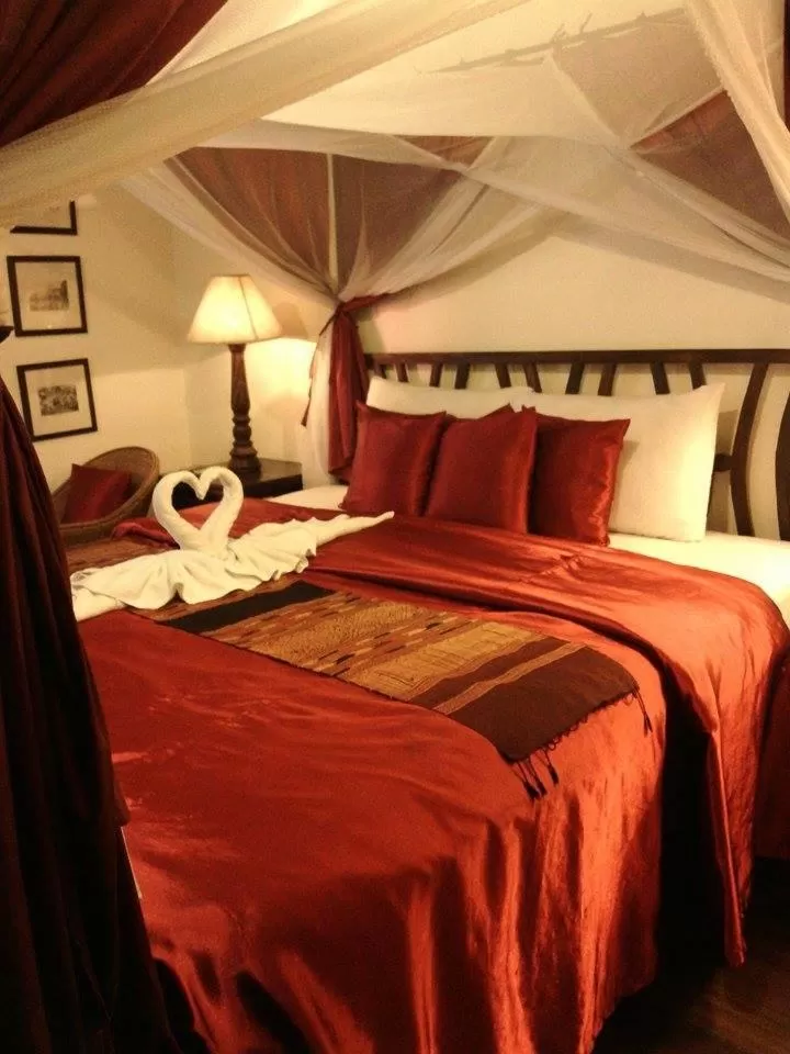 Bed in Tri Yaan Na Ros Colonial House