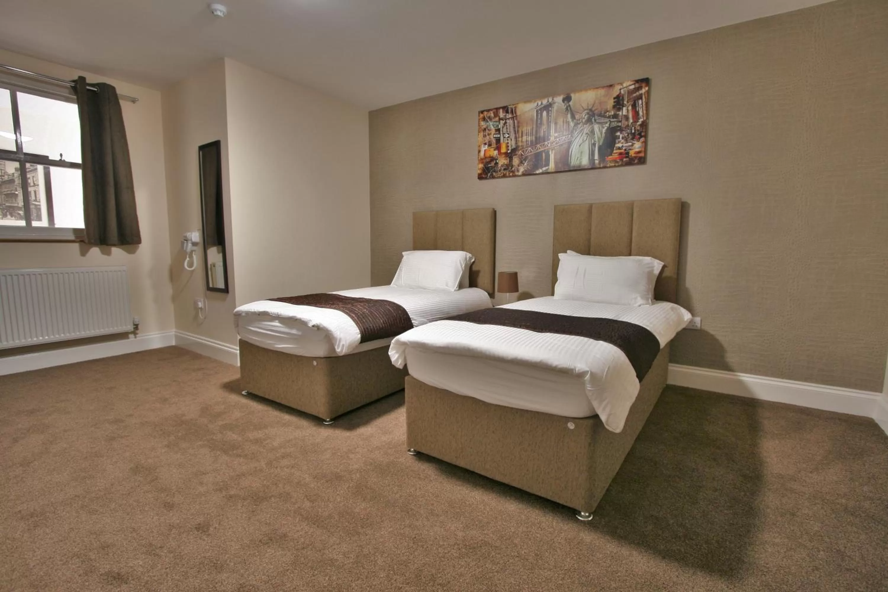 Bed in New County Hotel & Serviced Apartments by RoomsBooked