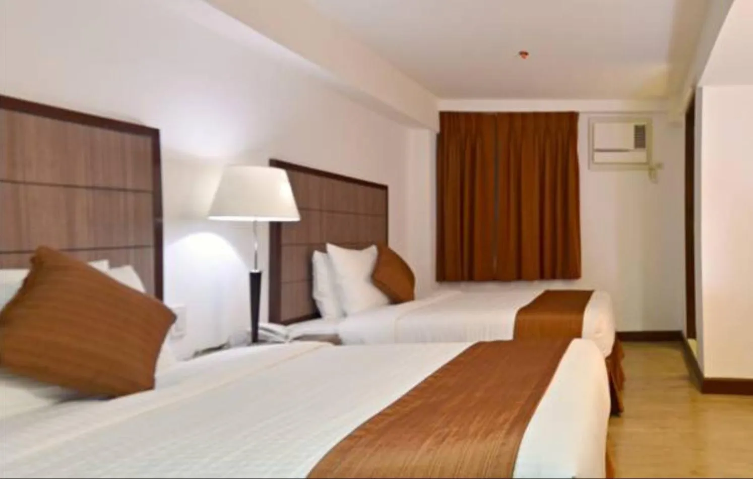 Bed in Tyche Boutique Hotel