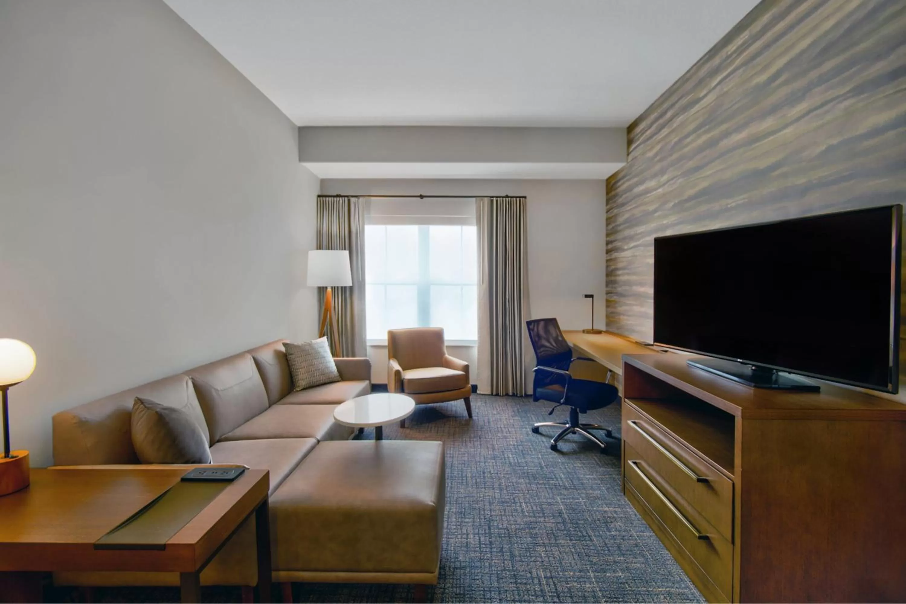 Living room in Residence Inn by Marriott Orlando at FLAMINGO CROSSINGS Town Center