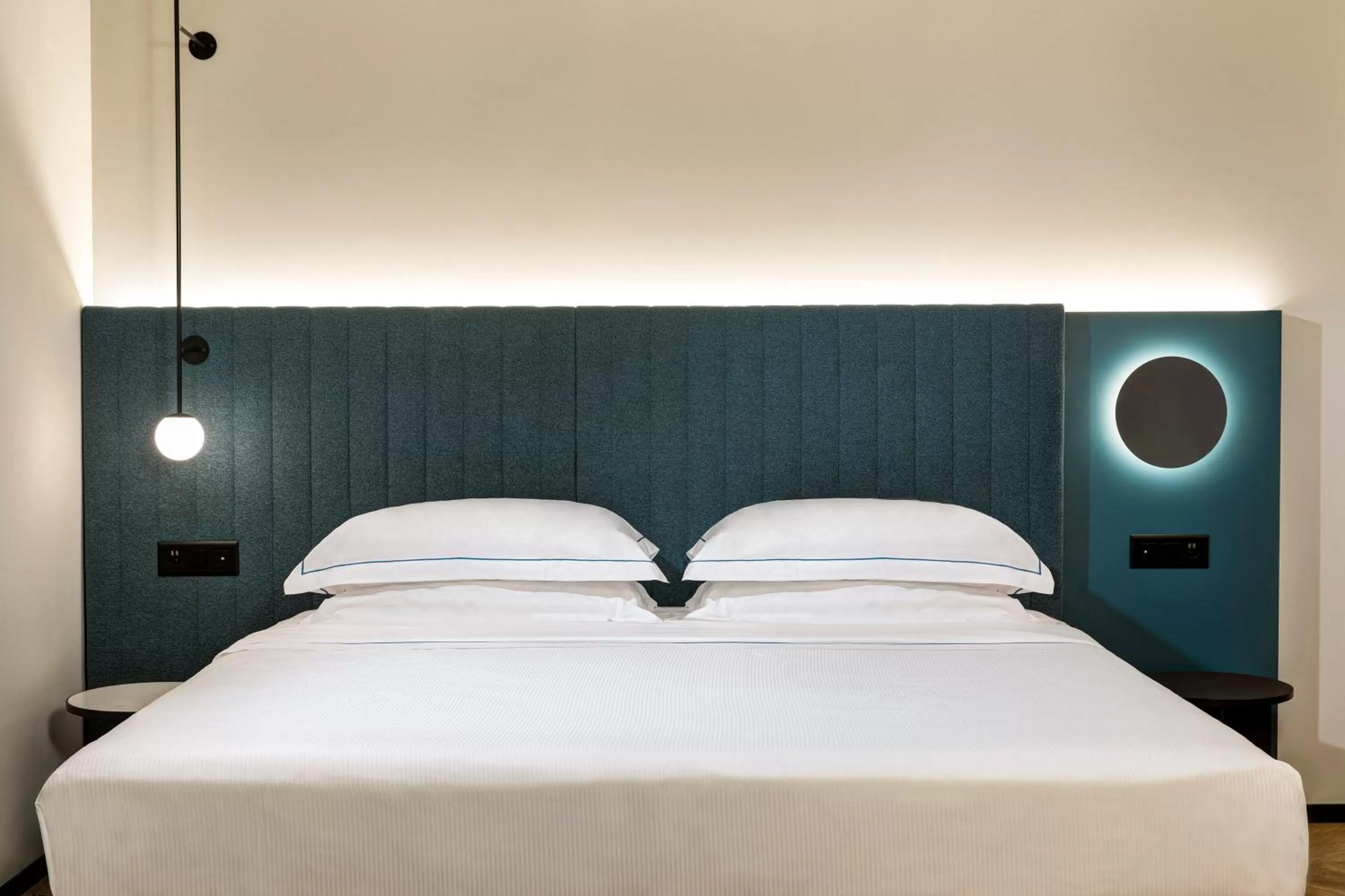 Bed in LUGANODANTE Boutique & Lifestyle Hotel