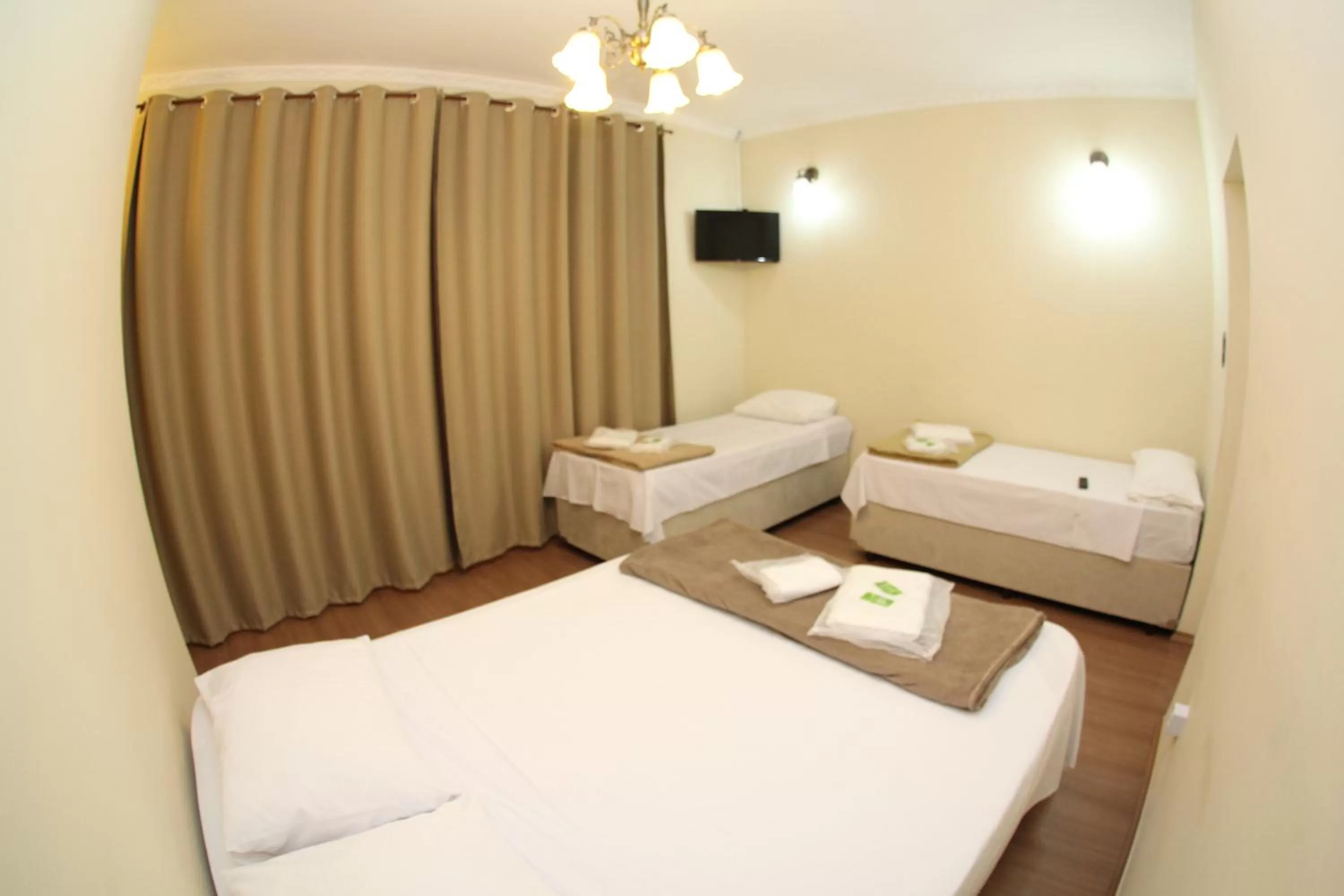 Bed in Pousada Santa Genebra