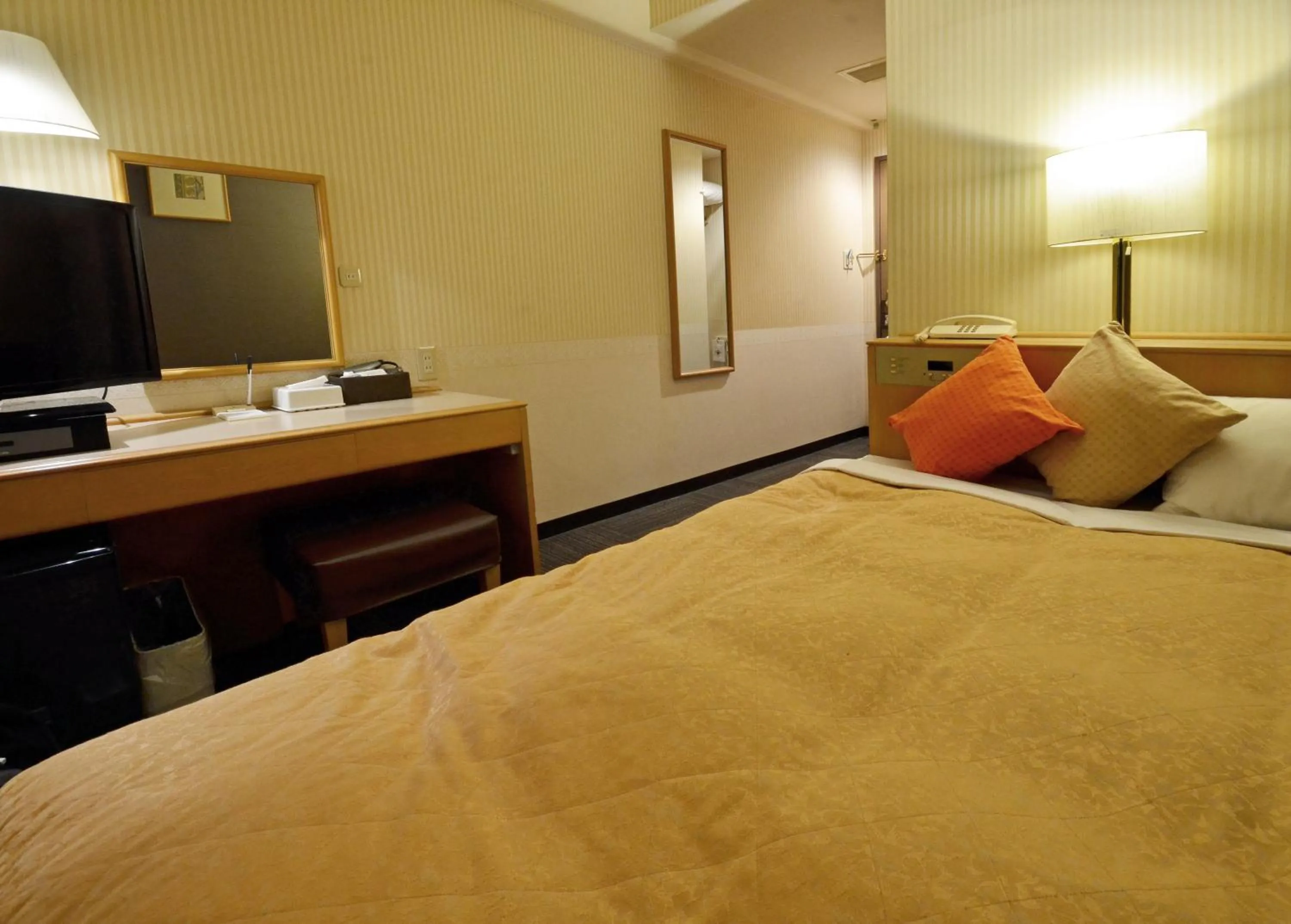 Decorative detail, Bed in Omura Central Hotel