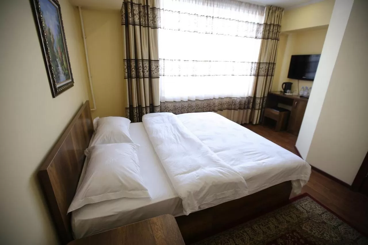 Bed in Altai Business Hotel