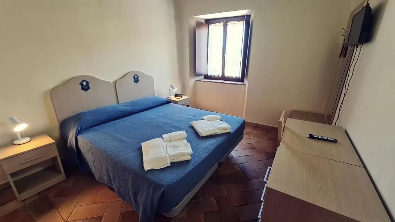 Bed in Borgo de' Varano by Hotel I Duchi