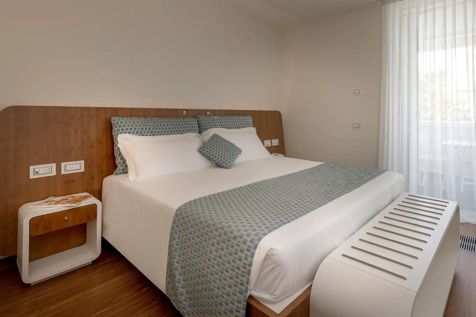 Bed in T-Suite Hotel