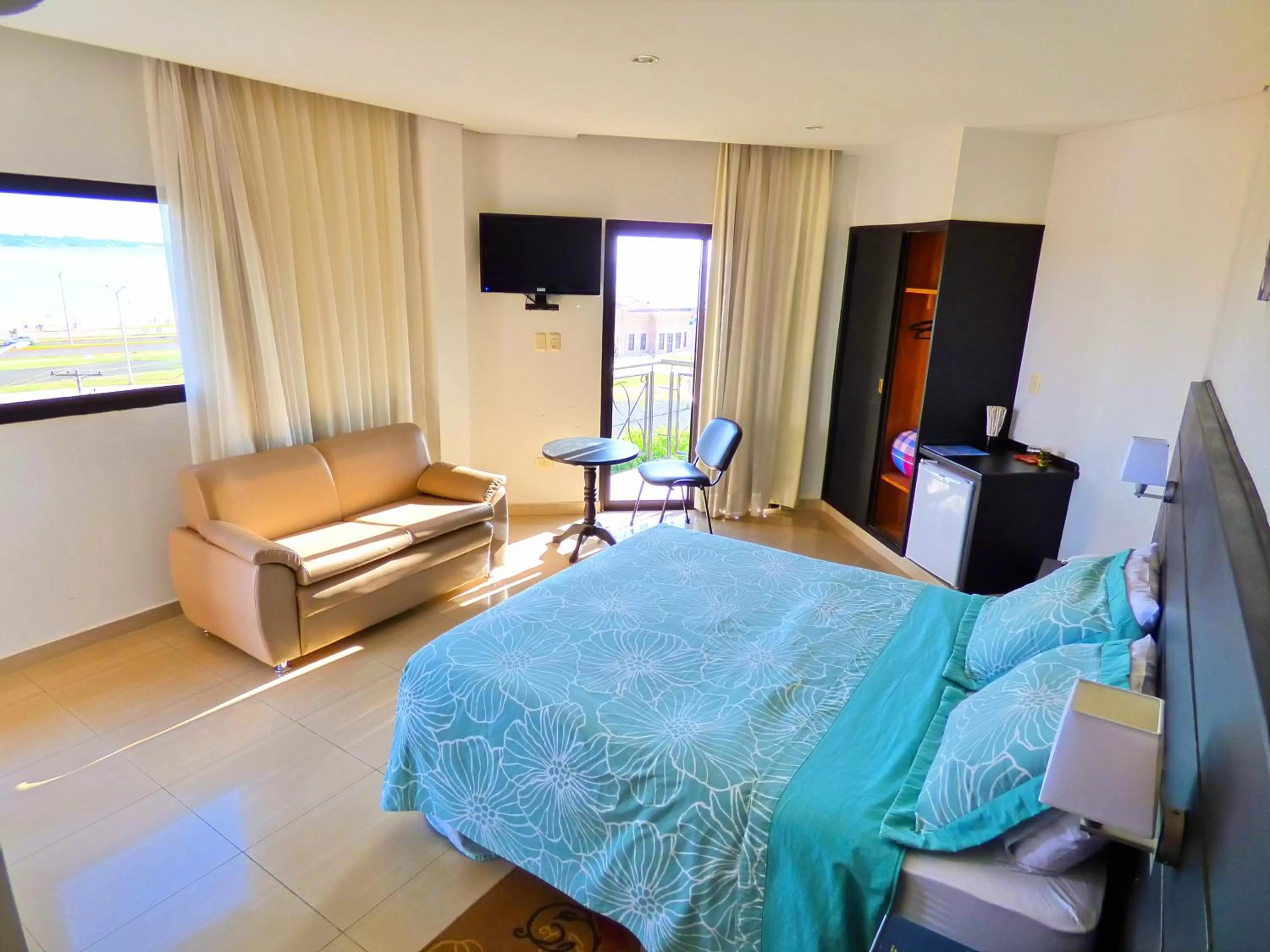 Bed in De La Costa Hotel