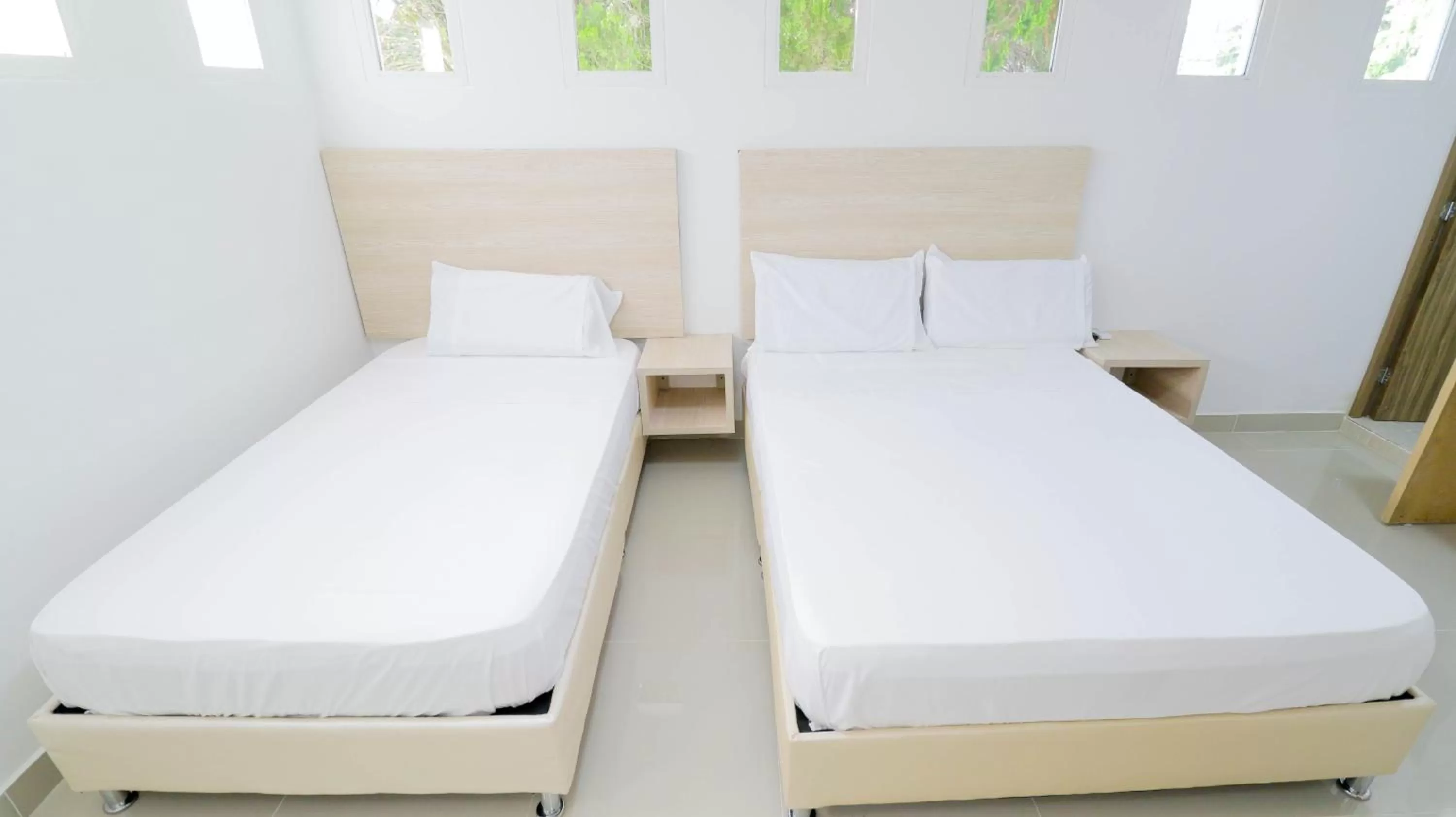 Bed in Aw Hotel Pasarela Real