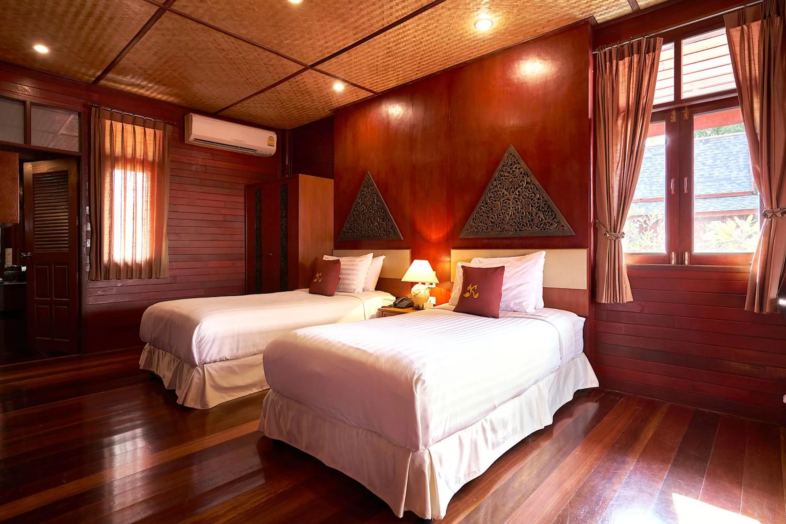 Bed in Ruenkanok Thaihouse Resort