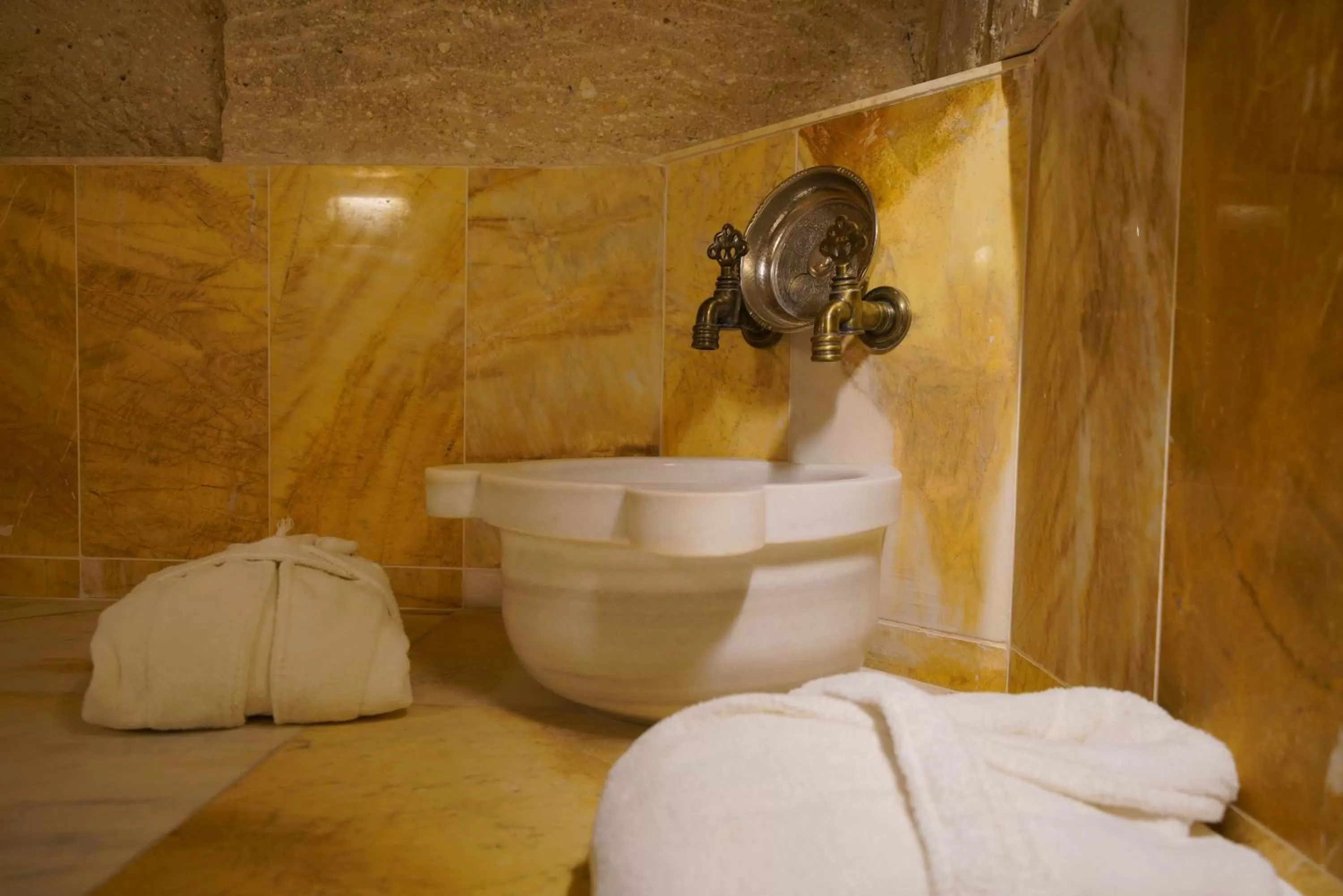 Public Bath in Shoestring Cave House