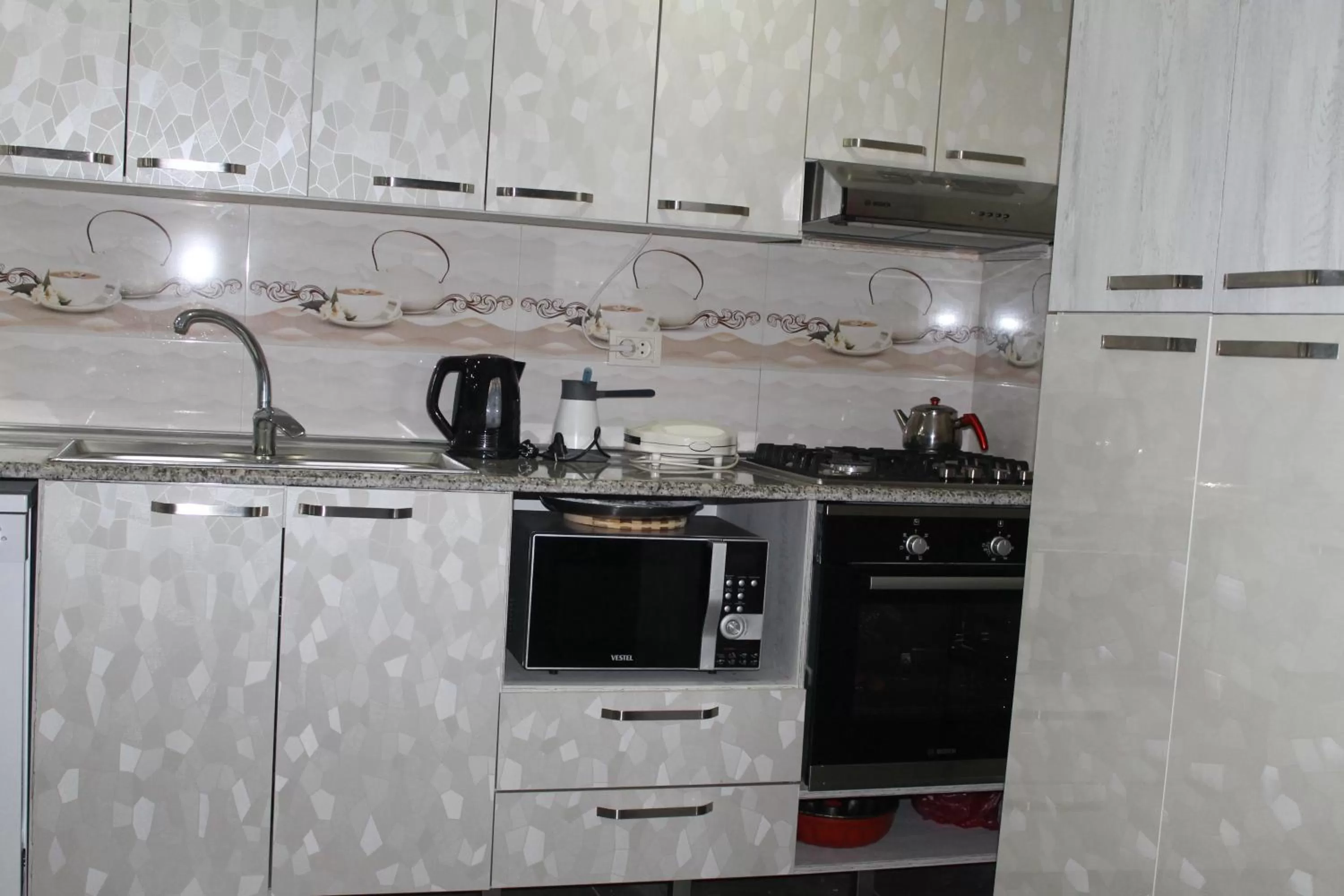 Kitchen or kitchenette in Hotel Tskhumi