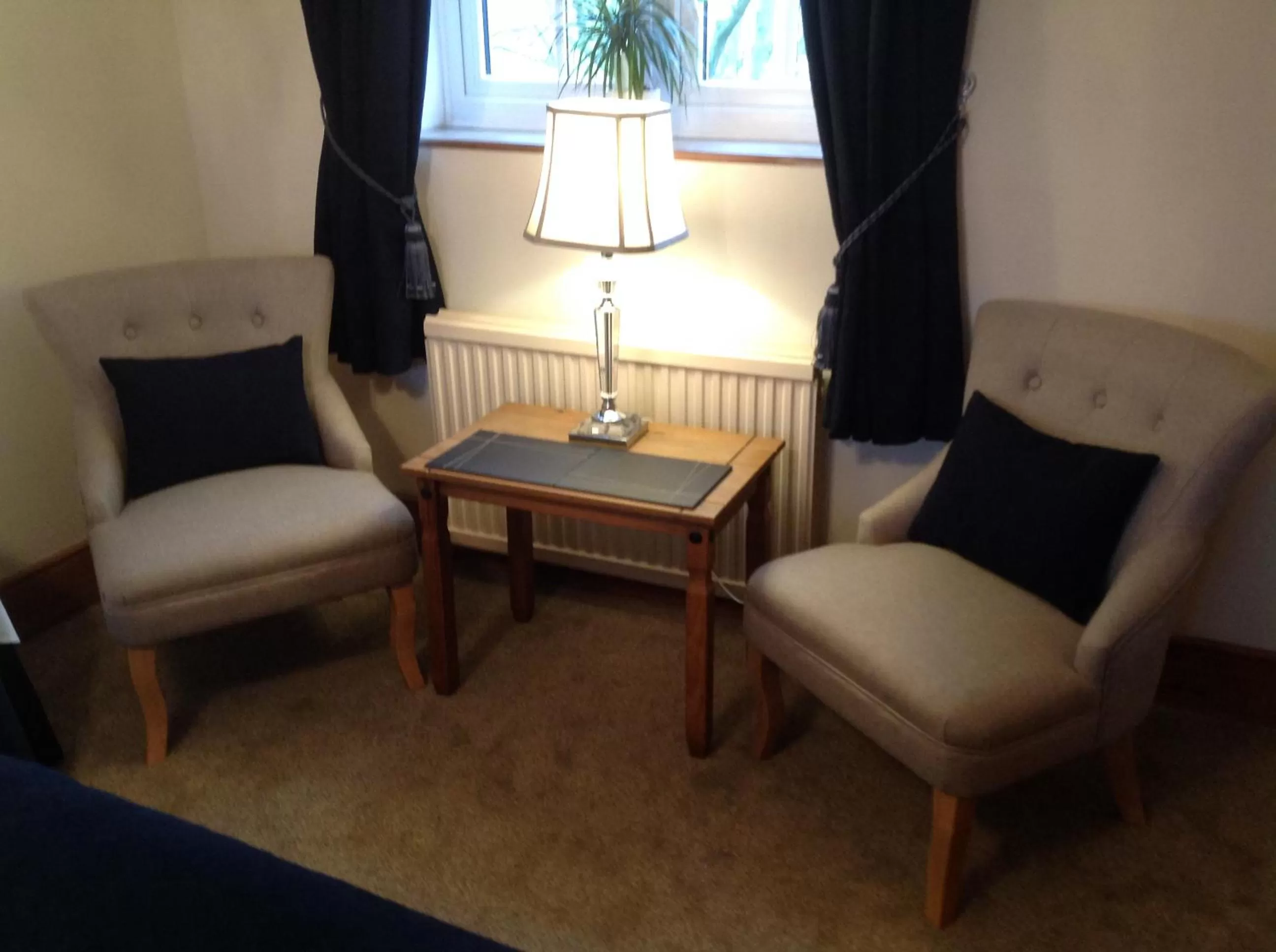 Bedroom, Seating Area in Primrose Cottage