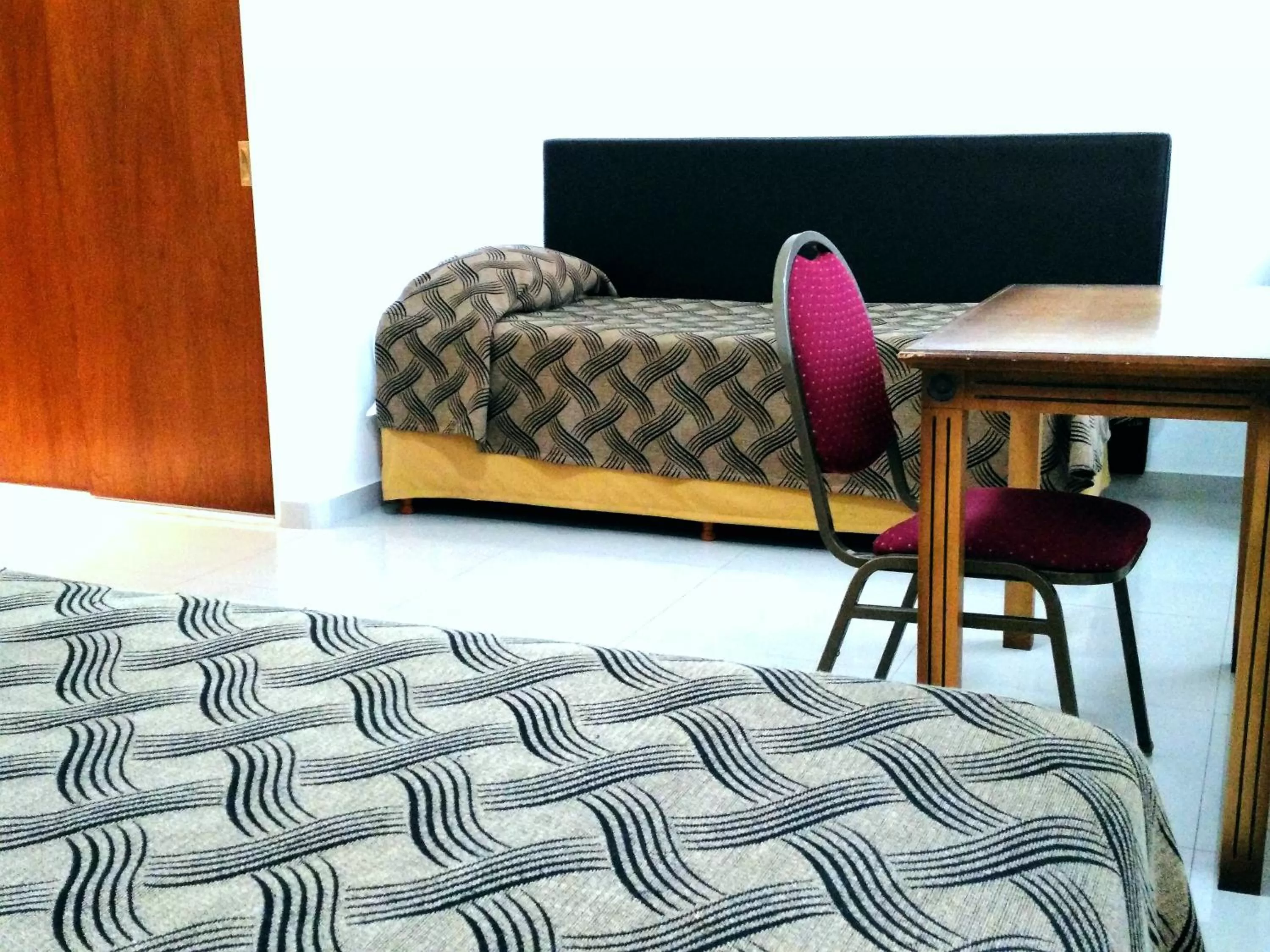 Bedroom, Bed in Tritone Hotel