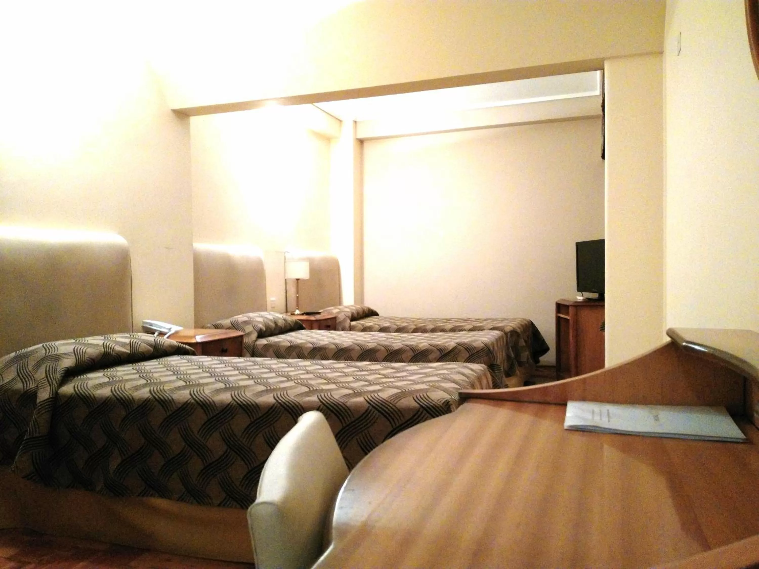 Bedroom, Bed in Tritone Hotel
